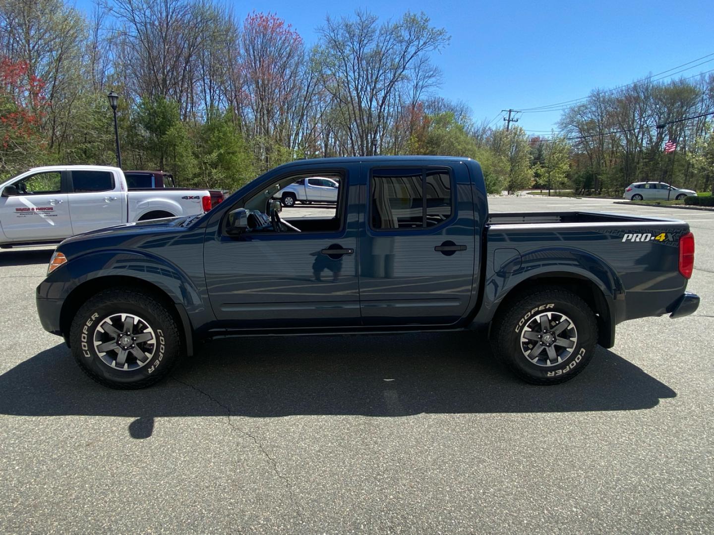 2019 Blue /Grey Nissan Frontier SL Crew Cab 5AT 4WD Pro-4 (1N6AD0EV1KN) with an 4.0L V6 DOHC 24V engine, 5A transmission, located at 215 Milton St, Dedham, MA, 02026, (781) 329-5144, 42.241905, -71.157295 - Single Owner, Low Mileage 4WD. Sure to please on every level!! Prices on all vehicles do not include $299.95 Documentation fee, as well as Massachusetts sales tax, Registration, Title Fee and State inspection. We try our hardest to be as accurate in our descriptions as possible. ASPI Motor Ca - Photo#4