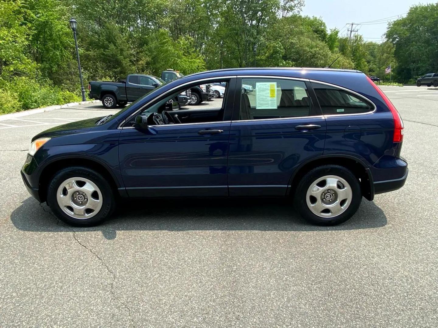 2009 Blue /Grey Honda CR-V LX 4WD 5-Speed AT (JHLRE48379C) with an 2.4L L4 DOHC 16V engine, 5-Speed Automatic transmission, located at 215 Milton St, Dedham, MA, 02026, (781) 329-5144, 42.241905, -71.157295 - Super Clean CRV Drives well. Looks great Always Honda Quality Always Fully warrantied Prices on all vehicles do not include $299.95 Documentation fee, as well as Massachusetts sales tax, Registration, Title Fee and State inspection. We try our hardest to be as accurate in our descriptions as - Photo#4