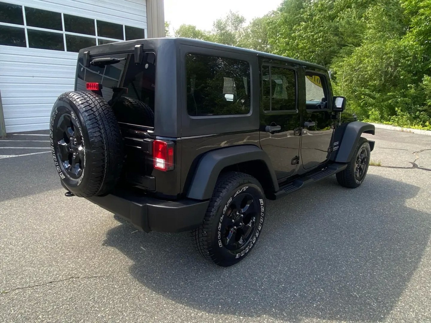 2010 BLACK /Gray Jeep Wrangler Unlimited Sport 4WD (1J4BA3H1XAL) with an 3.8L V6 OHV 12V engine, Automatic transmission, located at 215 Milton St, Dedham, MA, 02026, (781) 329-5144, 42.241905, -71.157295 - Meet a Black 2010 Jeep Wrangler that’s always ready to turn an ordinary commute into a mini adventure. With its classic SUV stance, removable top, and rugged attitude, this Wrangler is built for drivers who like their weekends spontaneous and their roads optional. Under the hood, the gasoline 3.8L- Photo#2
