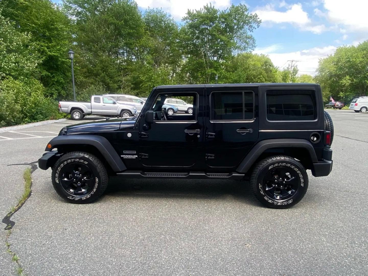 2010 BLACK /Gray Jeep Wrangler Unlimited Sport 4WD (1J4BA3H1XAL) with an 3.8L V6 OHV 12V engine, Automatic transmission, located at 215 Milton St, Dedham, MA, 02026, (781) 329-5144, 42.241905, -71.157295 - Meet a Black 2010 Jeep Wrangler that’s always ready to turn an ordinary commute into a mini adventure. With its classic SUV stance, removable top, and rugged attitude, this Wrangler is built for drivers who like their weekends spontaneous and their roads optional. Under the hood, the gasoline 3.8L- Photo#4