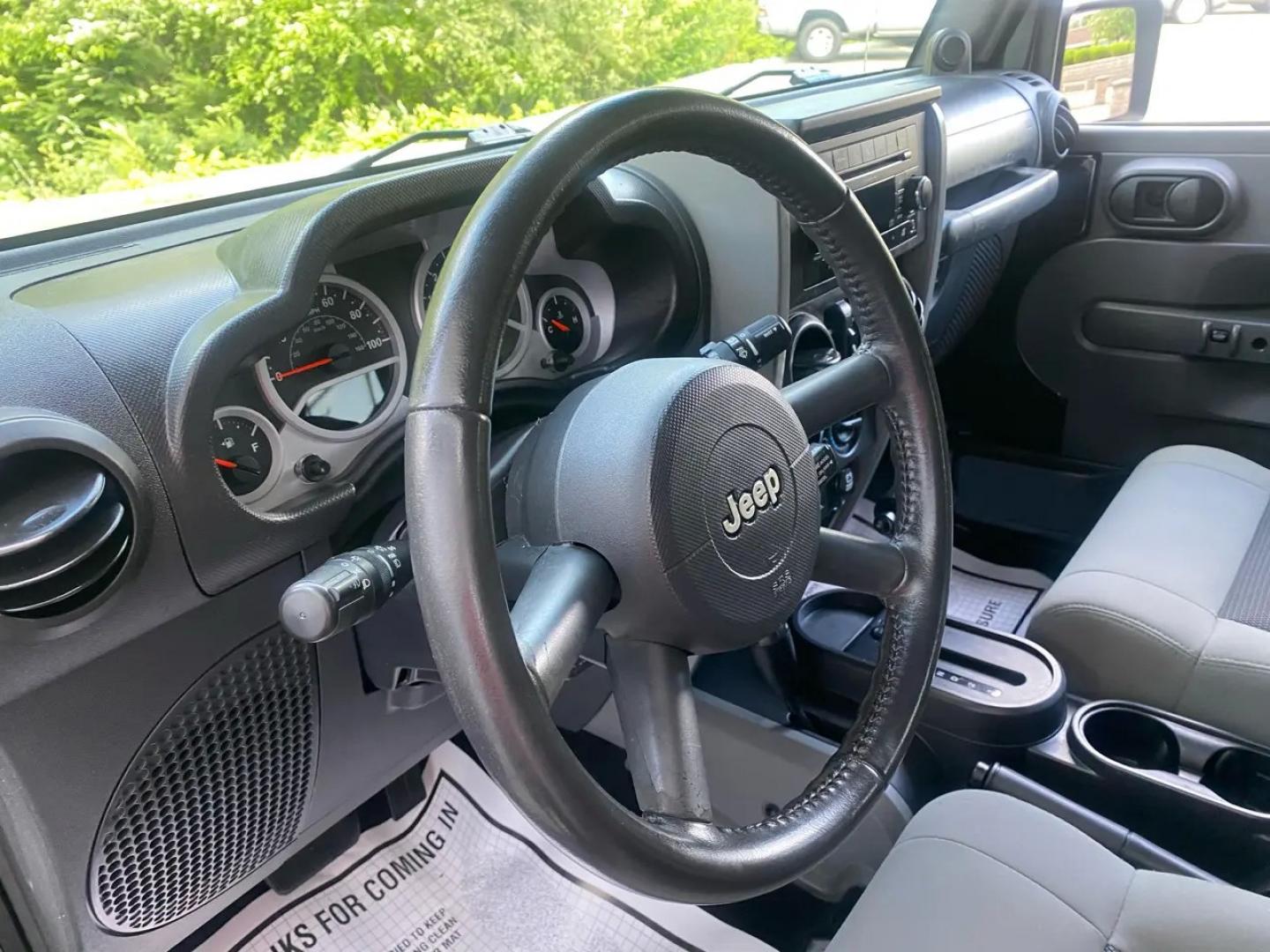 2010 BLACK /Gray Jeep Wrangler Unlimited Sport 4WD (1J4BA3H1XAL) with an 3.8L V6 OHV 12V engine, Automatic transmission, located at 215 Milton St, Dedham, MA, 02026, (781) 329-5144, 42.241905, -71.157295 - Meet a Black 2010 Jeep Wrangler that’s always ready to turn an ordinary commute into a mini adventure. With its classic SUV stance, removable top, and rugged attitude, this Wrangler is built for drivers who like their weekends spontaneous and their roads optional. Under the hood, the gasoline 3.8L- Photo#8