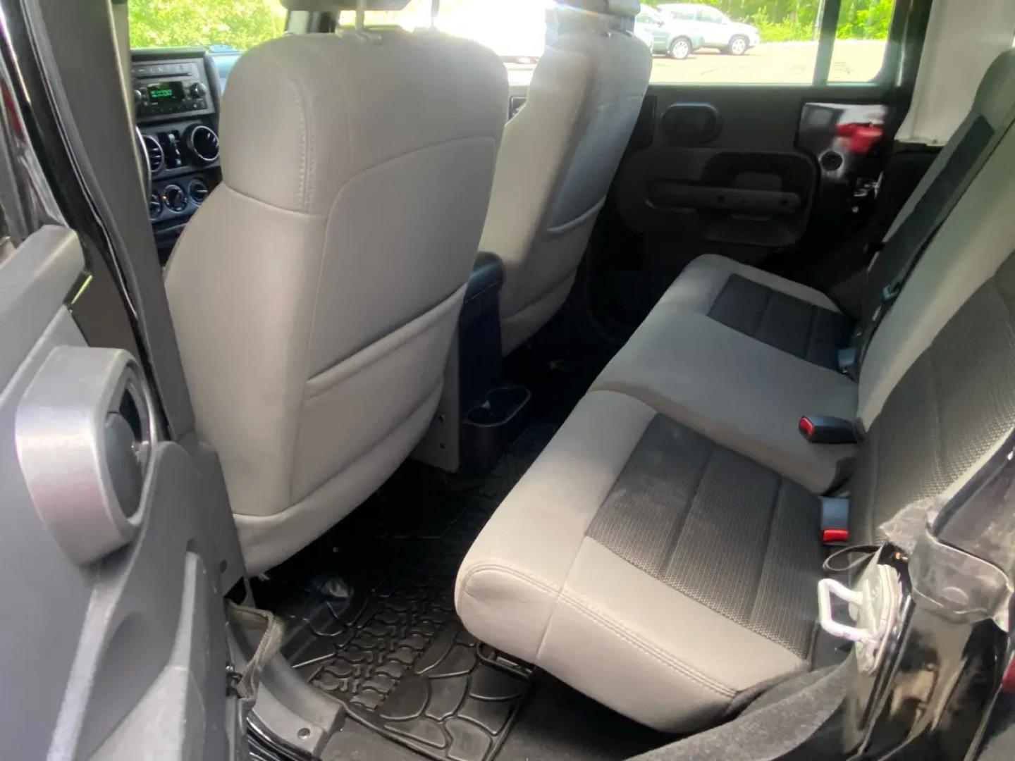 2010 BLACK /Gray Jeep Wrangler Unlimited Sport 4WD (1J4BA3H1XAL) with an 3.8L V6 OHV 12V engine, Automatic transmission, located at 215 Milton St, Dedham, MA, 02026, (781) 329-5144, 42.241905, -71.157295 - Meet a Black 2010 Jeep Wrangler that’s always ready to turn an ordinary commute into a mini adventure. With its classic SUV stance, removable top, and rugged attitude, this Wrangler is built for drivers who like their weekends spontaneous and their roads optional. Under the hood, the gasoline 3.8L- Photo#14