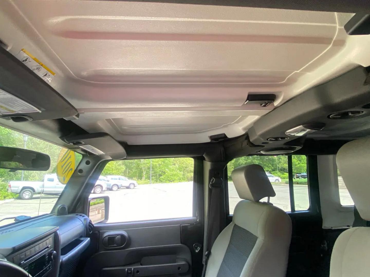 2010 BLACK /Gray Jeep Wrangler Unlimited Sport 4WD (1J4BA3H1XAL) with an 3.8L V6 OHV 12V engine, Automatic transmission, located at 215 Milton St, Dedham, MA, 02026, (781) 329-5144, 42.241905, -71.157295 - Meet a Black 2010 Jeep Wrangler that’s always ready to turn an ordinary commute into a mini adventure. With its classic SUV stance, removable top, and rugged attitude, this Wrangler is built for drivers who like their weekends spontaneous and their roads optional. Under the hood, the gasoline 3.8L- Photo#16