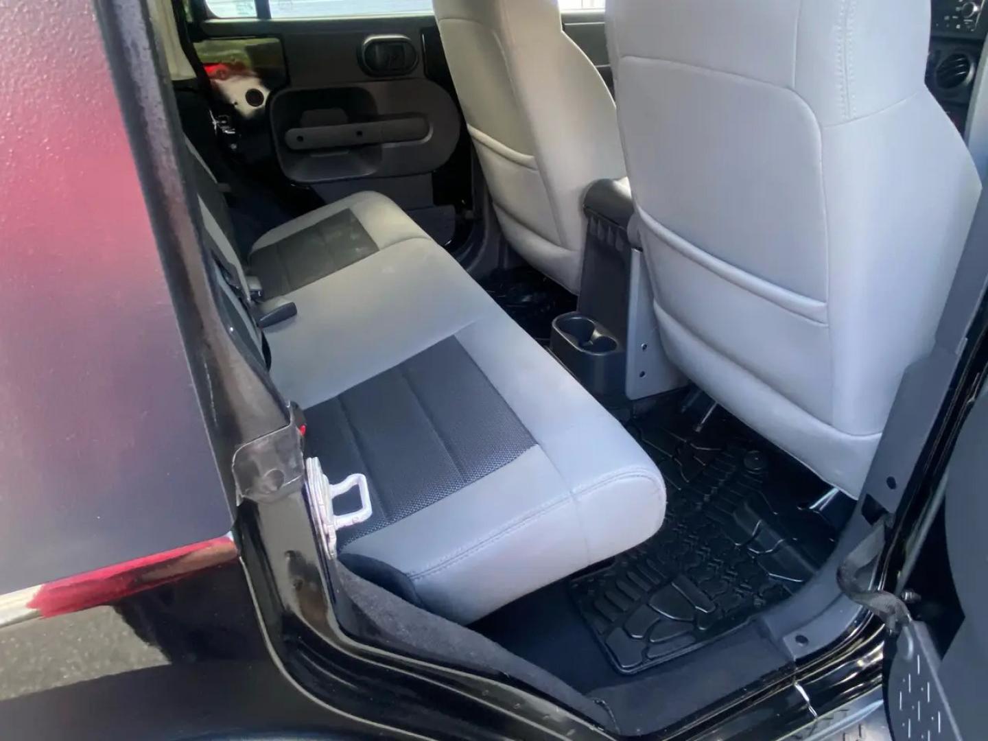 2010 BLACK /Gray Jeep Wrangler Unlimited Sport 4WD (1J4BA3H1XAL) with an 3.8L V6 OHV 12V engine, Automatic transmission, located at 215 Milton St, Dedham, MA, 02026, (781) 329-5144, 42.241905, -71.157295 - Meet a Black 2010 Jeep Wrangler that’s always ready to turn an ordinary commute into a mini adventure. With its classic SUV stance, removable top, and rugged attitude, this Wrangler is built for drivers who like their weekends spontaneous and their roads optional. Under the hood, the gasoline 3.8L- Photo#13