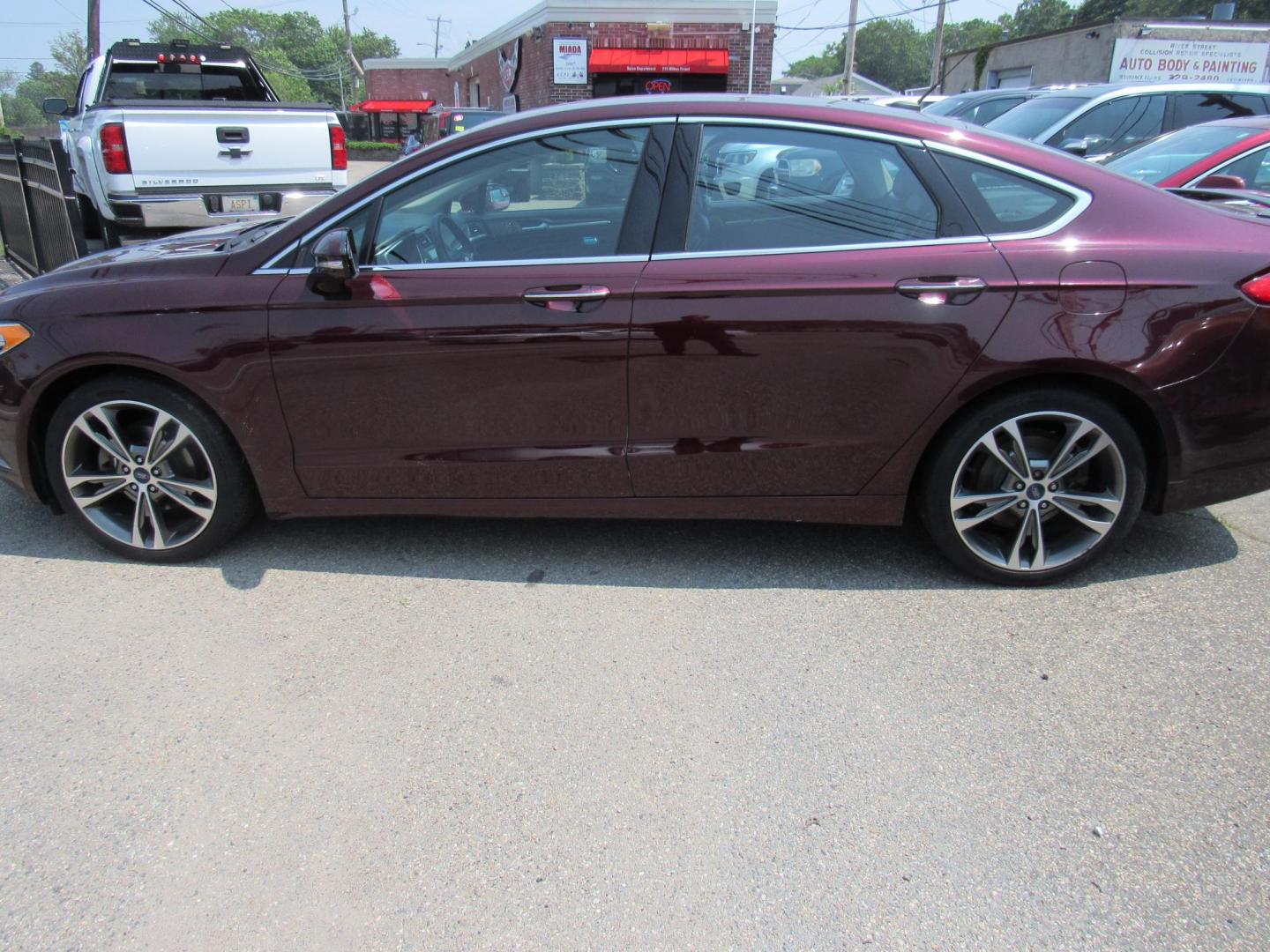 2017 Maroon /Black Ford Fusion Titanium (3FA6P0K99HR) with an 2.0L L4 DOHC 16V engine, 6A transmission, located at 215 Milton St, Dedham, MA, 02026, (781) 329-5144, 42.241905, -71.157295 - This nice loaded sedan is in excellent condition. Runs as good as it looks. Low mileage. All ASPI Motor Cars vehicles are fully service before they are delivered to assure the highest quality used vehicles. Comes with a 3/3 warranty included in the price. Call for details. all vehicles do not i - Photo#3