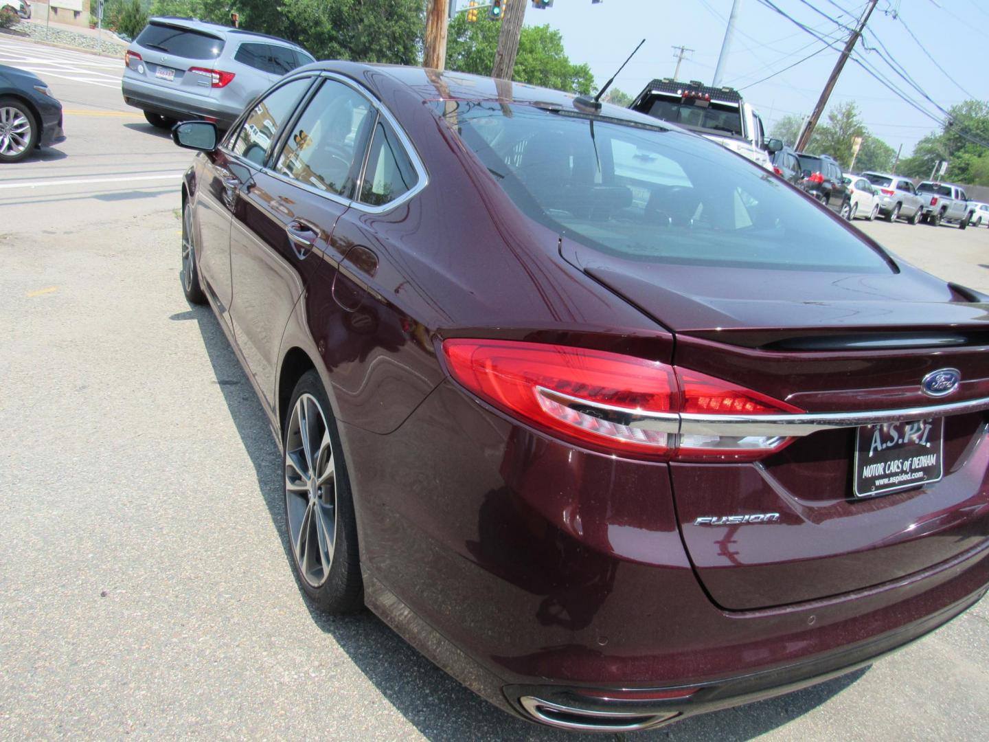 2017 Maroon /Black Ford Fusion Titanium (3FA6P0K99HR) with an 2.0L L4 DOHC 16V engine, 6A transmission, located at 215 Milton St, Dedham, MA, 02026, (781) 329-5144, 42.241905, -71.157295 - This nice loaded sedan is in excellent condition. Runs as good as it looks. Low mileage. All ASPI Motor Cars vehicles are fully service before they are delivered to assure the highest quality used vehicles. Comes with a 3/3 warranty included in the price. Call for details. all vehicles do not i - Photo#4