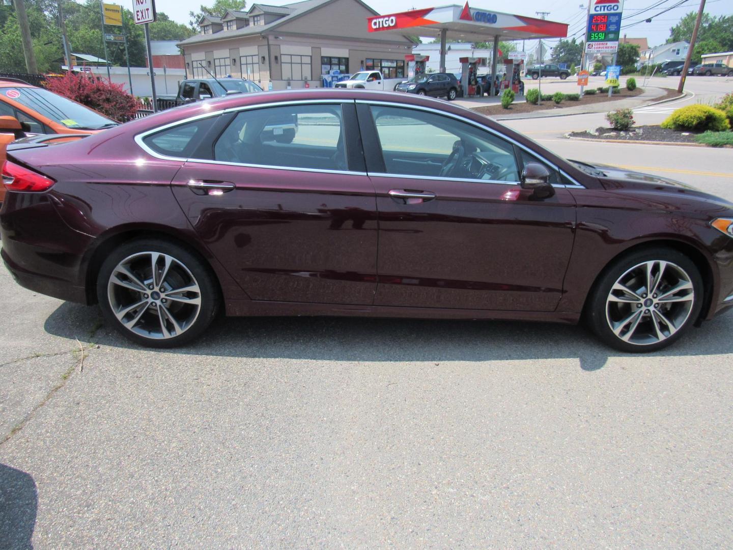 2017 Maroon /Black Ford Fusion Titanium (3FA6P0K99HR) with an 2.0L L4 DOHC 16V engine, 6A transmission, located at 215 Milton St, Dedham, MA, 02026, (781) 329-5144, 42.241905, -71.157295 - This nice loaded sedan is in excellent condition. Runs as good as it looks. Low mileage. All ASPI Motor Cars vehicles are fully service before they are delivered to assure the highest quality used vehicles. Comes with a 3/3 warranty included in the price. Call for details. all vehicles do not i - Photo#7