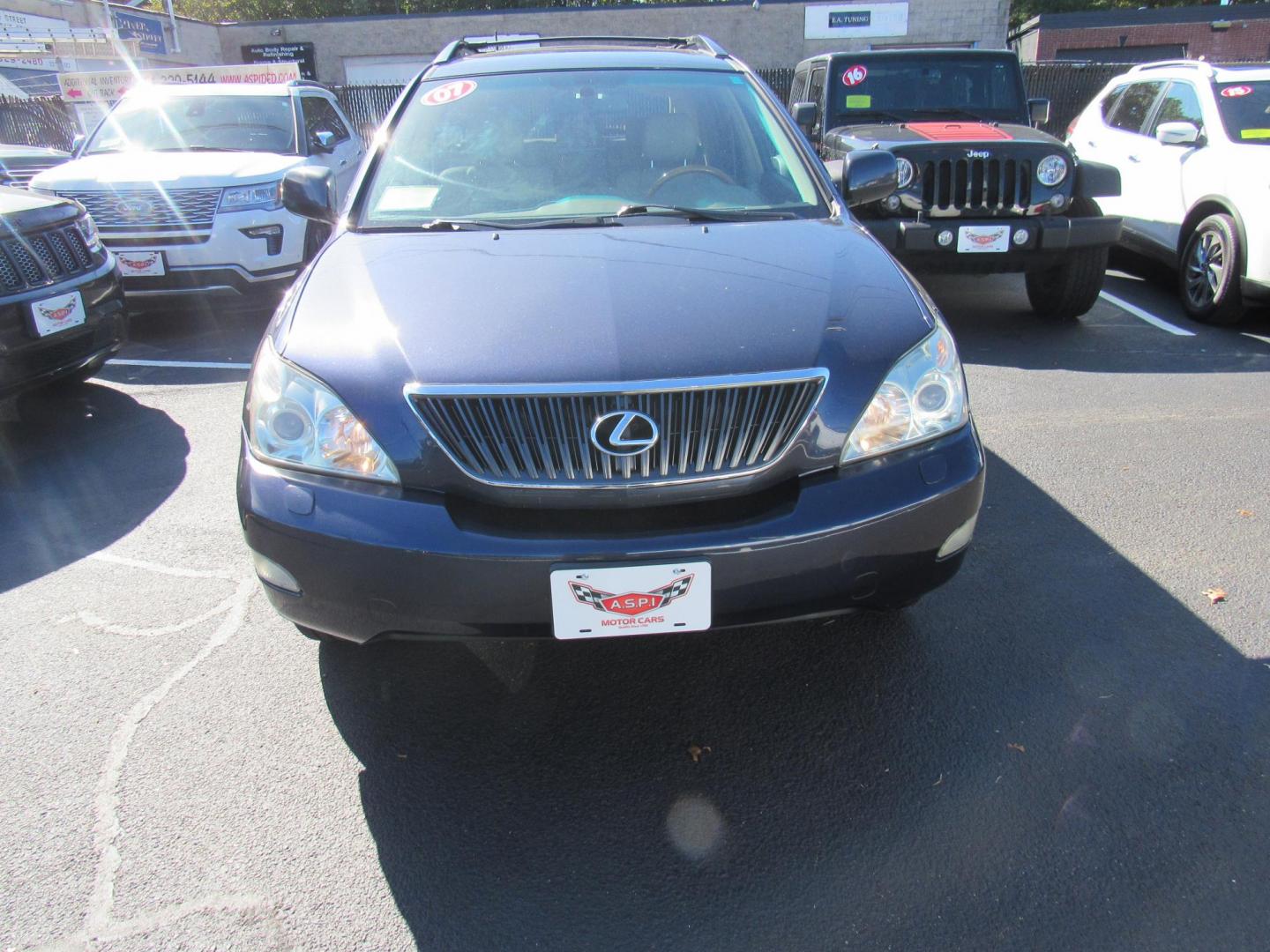 2007 Blue /Tan Lexus RX 350 AWD (2T2HK31U17C) with an 3.5L V6 DOHC 24V engine, 5-Speed Automatic Overdrive transmission, located at 215 Milton St, Dedham, MA, 02026, (781) 329-5144, 42.241905, -71.157295 - This nice Lexus has low mileage for the year. Runs like new . All ASPI Motor Cars vehicles are fully serviced before they are delivered to assure the highest quality used vehicles. Call Today! Prices on all vehicles do not include $299.95 Documentation fee, as well as Massachusetts sales tax, Reg - Photo#1