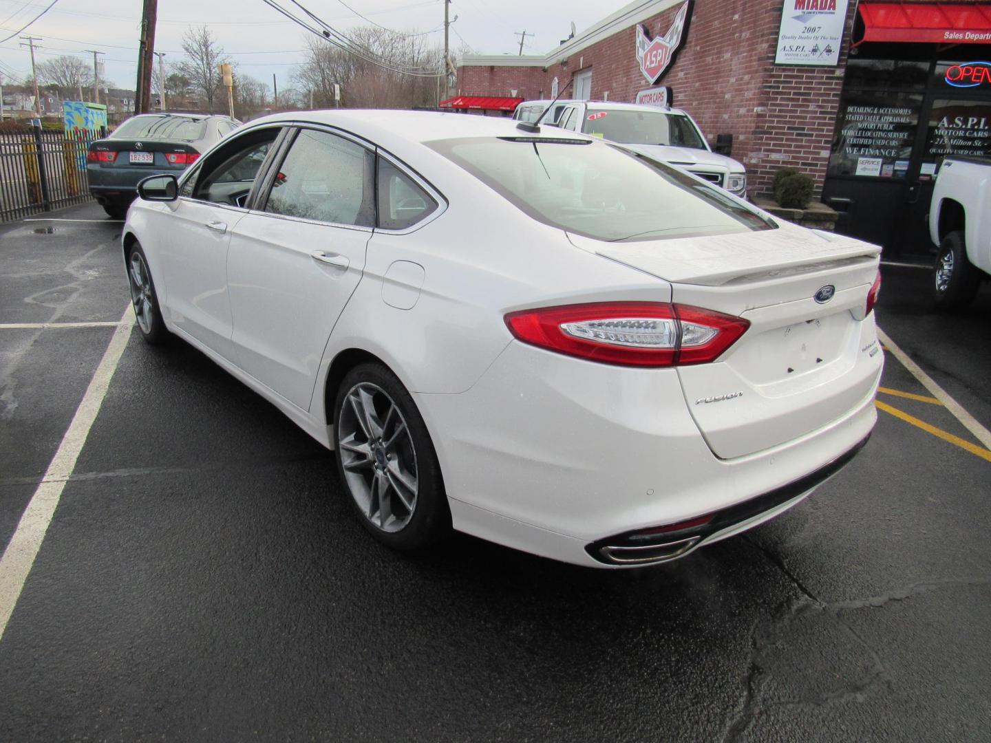 2015 White /Gray Ford Fusion Titanium (3FA6P0K98FR) with an 2.0L L4 DOHC 16V engine, Automatic transmission, located at 215 Milton St, Dedham, MA, 02026, (781) 329-5144, 42.241905, -71.157295 - This nice little sedan runs great. Loaded up Titanium. All ASPI Motor Cars vehicles are fully serviced before they are delivered to assure the highest quality used vehicle. Call for details Prices on all vehicles do not include $299.95 Documentation fee, as well as Massachusetts sales tax, Regist - Photo#4