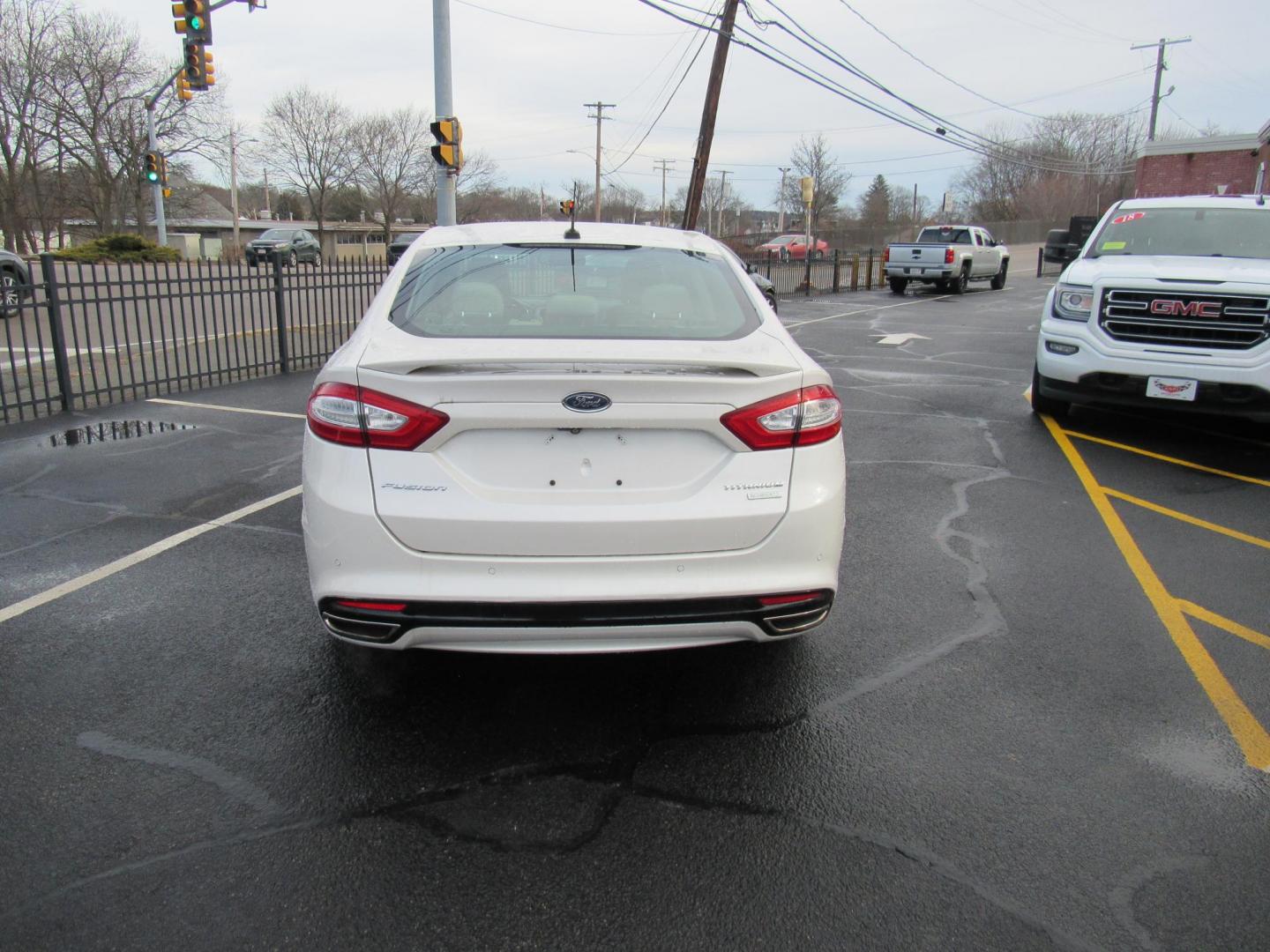 2015 White /Gray Ford Fusion Titanium (3FA6P0K98FR) with an 2.0L L4 DOHC 16V engine, Automatic transmission, located at 215 Milton St, Dedham, MA, 02026, (781) 329-5144, 42.241905, -71.157295 - This nice little sedan runs great. Loaded up Titanium. All ASPI Motor Cars vehicles are fully serviced before they are delivered to assure the highest quality used vehicle. Call for details Prices on all vehicles do not include $299.95 Documentation fee, as well as Massachusetts sales tax, Regist - Photo#5