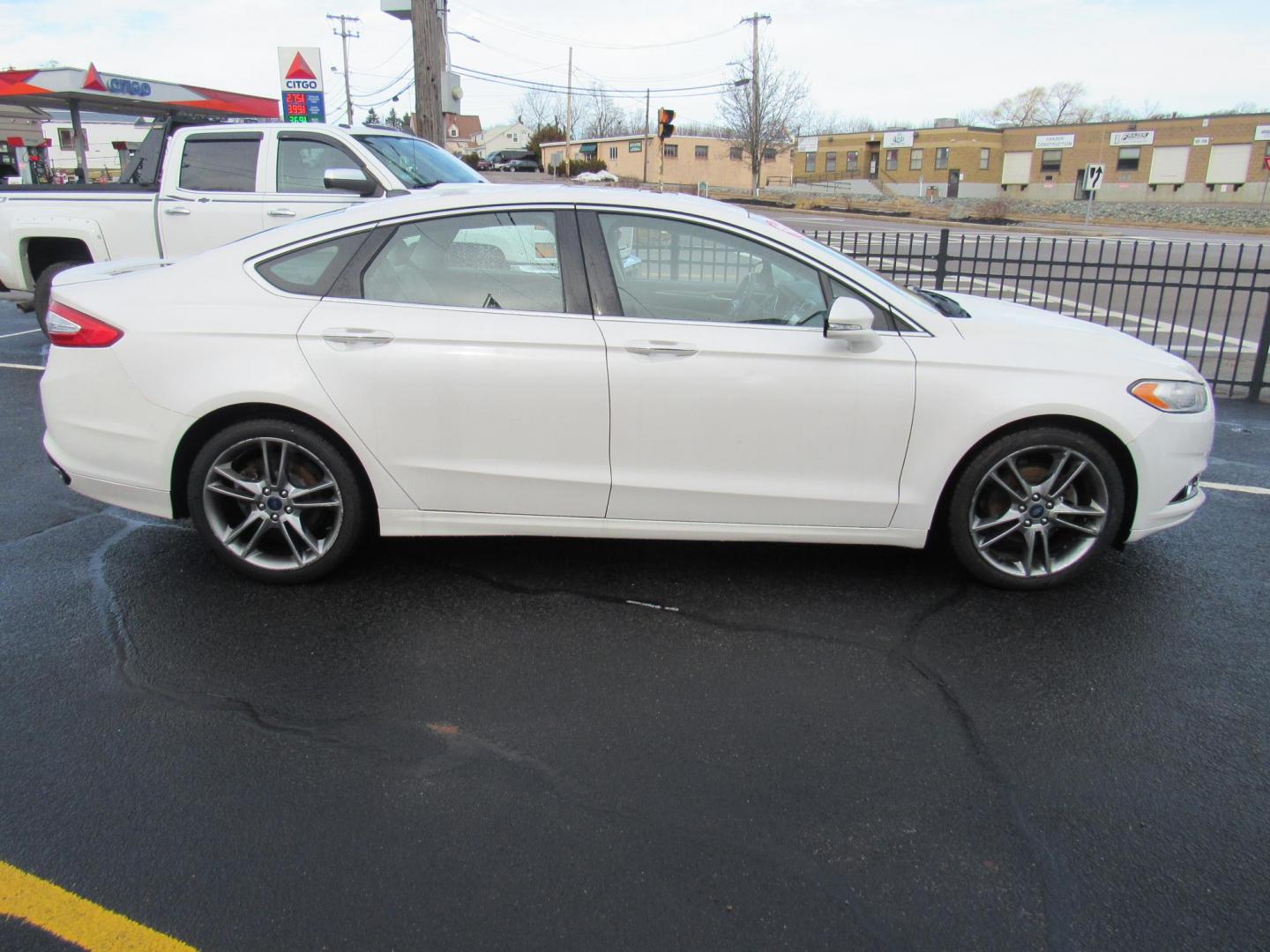 2015 White /Gray Ford Fusion Titanium (3FA6P0K98FR) with an 2.0L L4 DOHC 16V engine, Automatic transmission, located at 215 Milton St, Dedham, MA, 02026, (781) 329-5144, 42.241905, -71.157295 - This nice little sedan runs great. Loaded up Titanium. All ASPI Motor Cars vehicles are fully serviced before they are delivered to assure the highest quality used vehicle. Call for details Prices on all vehicles do not include $299.95 Documentation fee, as well as Massachusetts sales tax, Regist - Photo#7