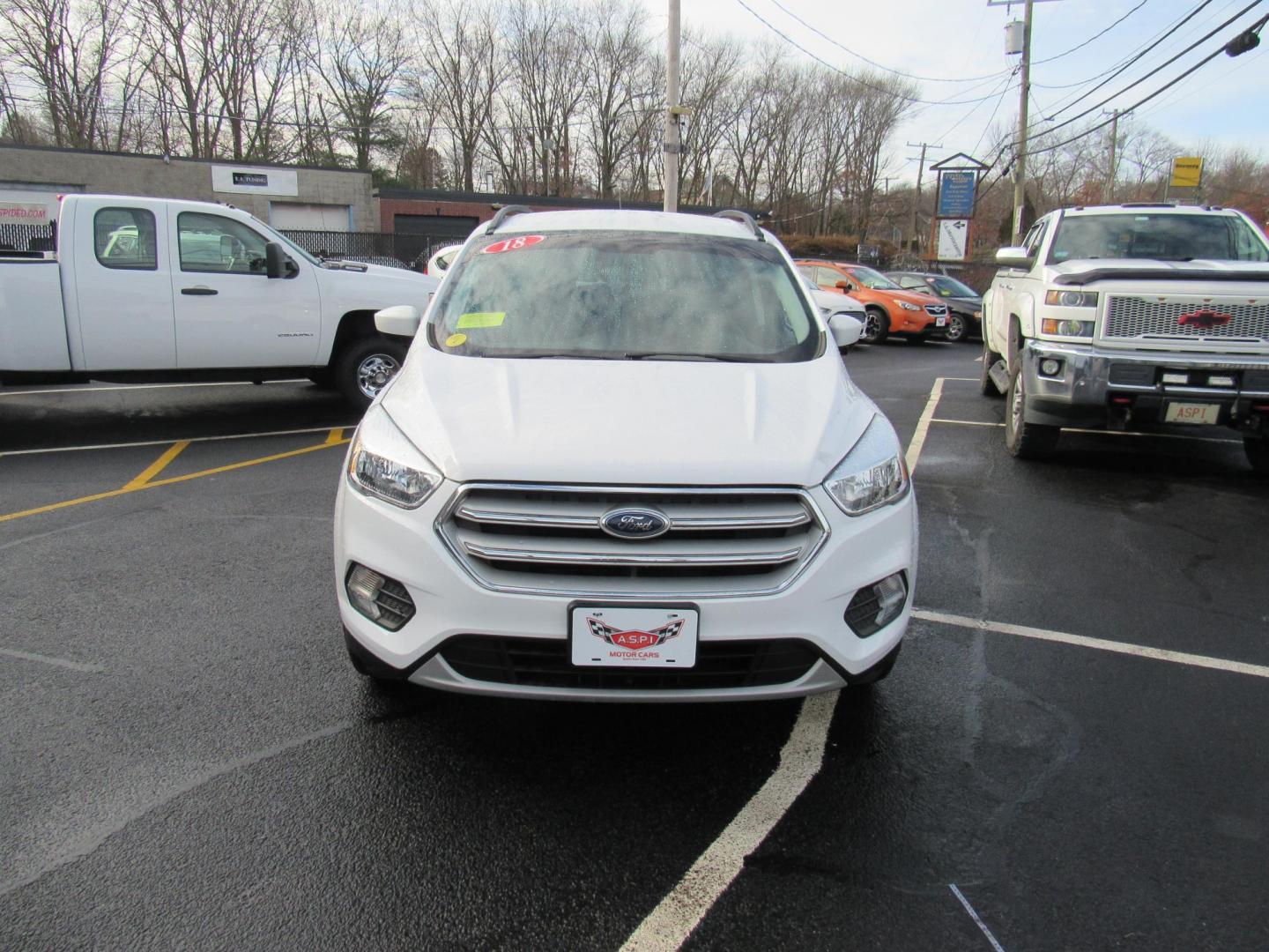 2018 White /Gray Ford Escape SE 4WD (1FMCU9GD5JU) with an 1.5L L4 DOHC 16V engine, 6A transmission, located at 215 Milton St, Dedham, MA, 02026, (781) 329-5144, 42.241905, -71.157295 - This nice little SUV is in excellent condition. Runs like new. All ASPI Motor Cars vehicles are fully serviced before they are delivered to assure the highest quality used vehicle. Call for details Prices on all vehicles do not include $299.95 Documentation fee, as well as Massachusetts sales ta - Photo#1