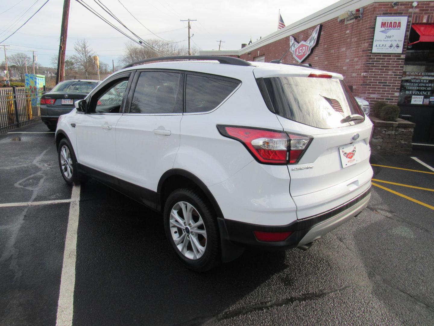 2018 White /Gray Ford Escape SE 4WD (1FMCU9GD5JU) with an 1.5L L4 DOHC 16V engine, 6A transmission, located at 215 Milton St, Dedham, MA, 02026, (781) 329-5144, 42.241905, -71.157295 - This nice little SUV is in excellent condition. Runs like new. All ASPI Motor Cars vehicles are fully serviced before they are delivered to assure the highest quality used vehicle. Call for details Prices on all vehicles do not include $299.95 Documentation fee, as well as Massachusetts sales ta - Photo#4