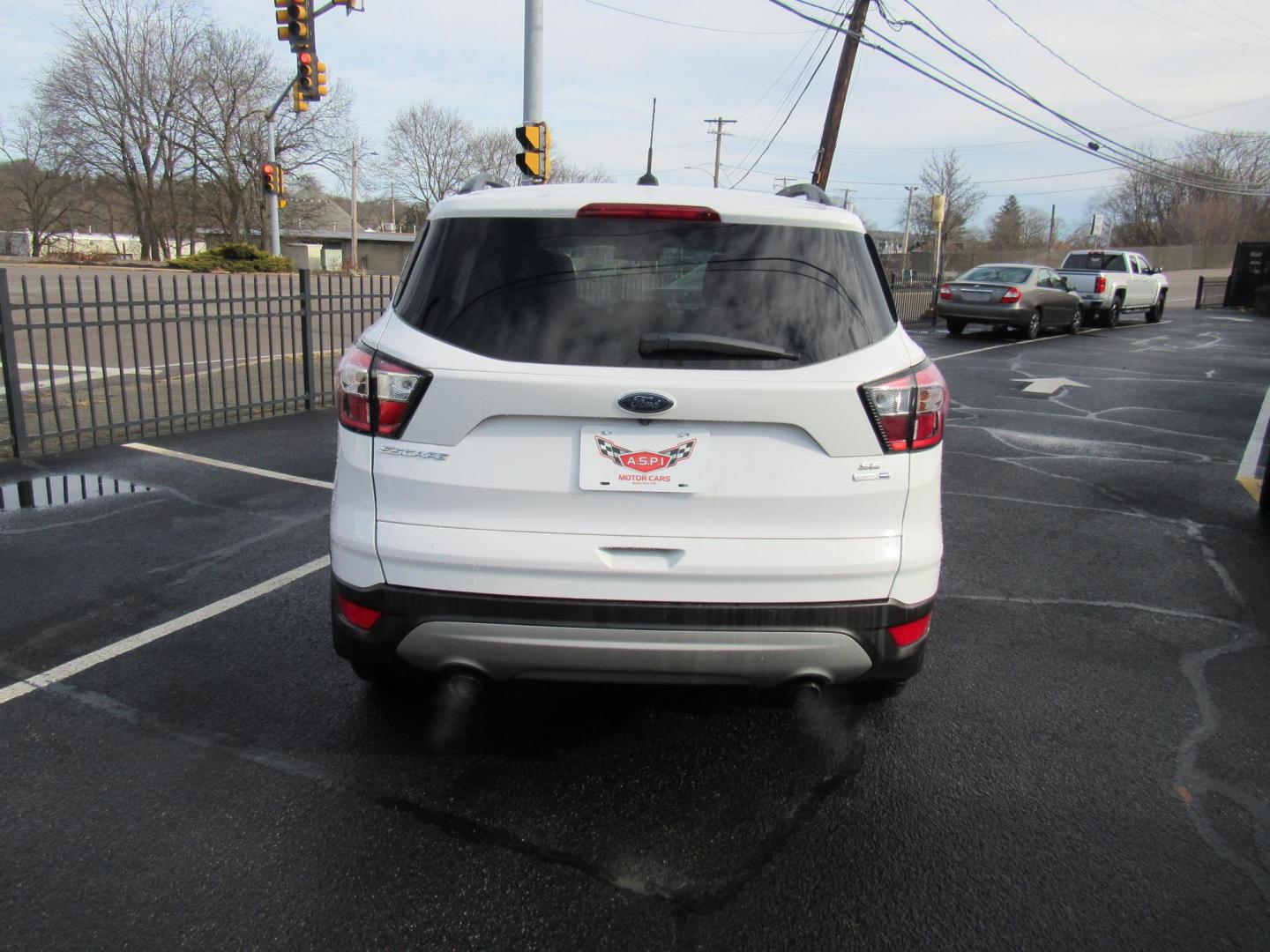 2018 White /Gray Ford Escape SE 4WD (1FMCU9GD5JU) with an 1.5L L4 DOHC 16V engine, 6A transmission, located at 215 Milton St, Dedham, MA, 02026, (781) 329-5144, 42.241905, -71.157295 - This nice little SUV is in excellent condition. Runs like new. All ASPI Motor Cars vehicles are fully serviced before they are delivered to assure the highest quality used vehicle. Call for details Prices on all vehicles do not include $299.95 Documentation fee, as well as Massachusetts sales ta - Photo#5