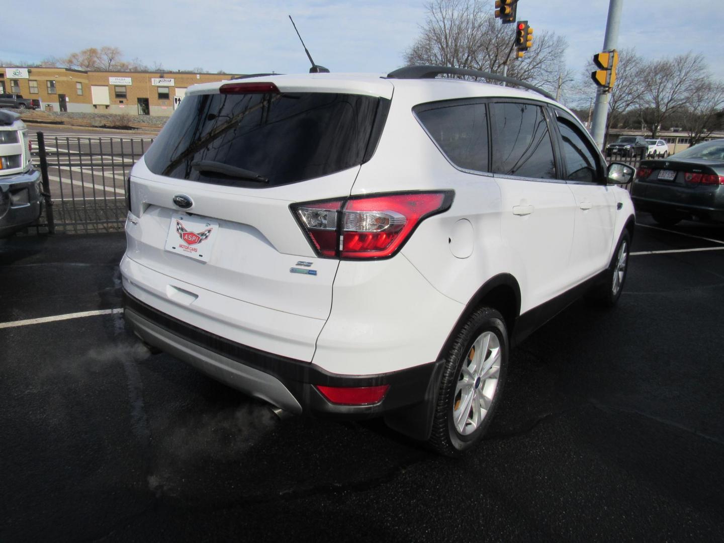 2018 White /Gray Ford Escape SE 4WD (1FMCU9GD5JU) with an 1.5L L4 DOHC 16V engine, 6A transmission, located at 215 Milton St, Dedham, MA, 02026, (781) 329-5144, 42.241905, -71.157295 - This nice little SUV is in excellent condition. Runs like new. All ASPI Motor Cars vehicles are fully serviced before they are delivered to assure the highest quality used vehicle. Call for details Prices on all vehicles do not include $299.95 Documentation fee, as well as Massachusetts sales ta - Photo#6