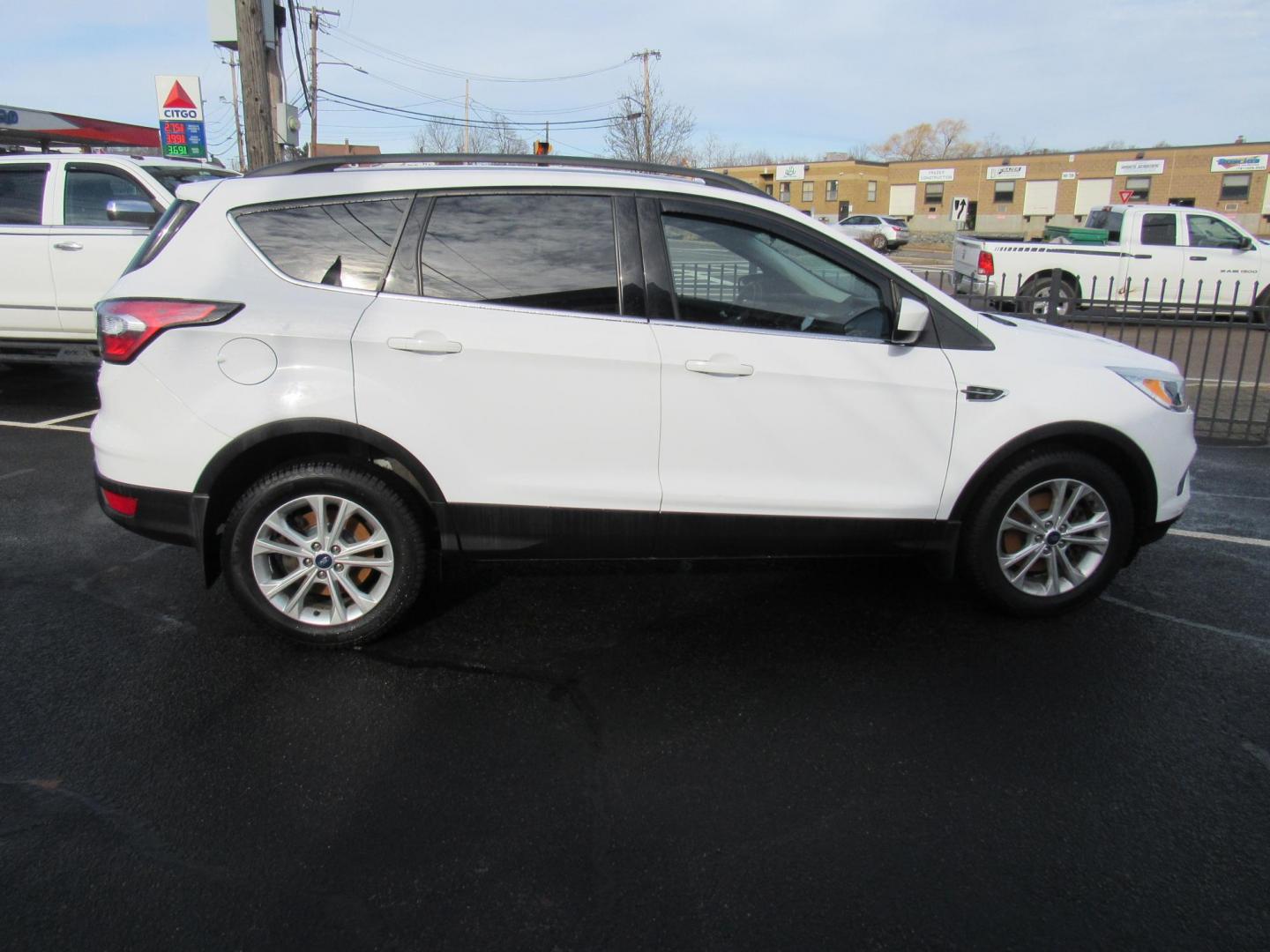 2018 White /Gray Ford Escape SE 4WD (1FMCU9GD5JU) with an 1.5L L4 DOHC 16V engine, 6A transmission, located at 215 Milton St, Dedham, MA, 02026, (781) 329-5144, 42.241905, -71.157295 - This nice little SUV is in excellent condition. Runs like new. All ASPI Motor Cars vehicles are fully serviced before they are delivered to assure the highest quality used vehicle. Call for details Prices on all vehicles do not include $299.95 Documentation fee, as well as Massachusetts sales ta - Photo#7