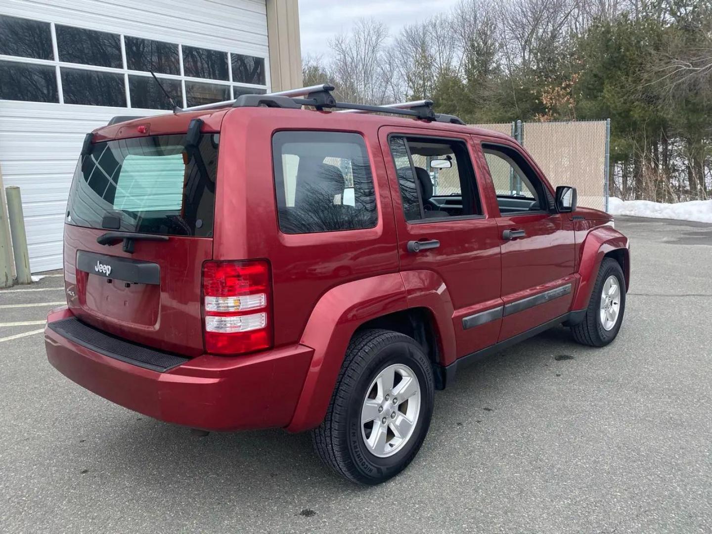 2012 Maroon /Grey Jeep Liberty Sport 4WD (1C4PJMAK9CW) with an 3.7L V6 SOHC 12V engine, 4-Speed Automatic transmission, located at 215 Milton St, Dedham, MA, 02026, (781) 329-5144, 42.241905, -71.157295 - Hop into this vibrant Burgundy 2012 Jeep Liberty and take on the roads with confidence! With its 4WD/AWD capabilities and traction control system, this adventure-ready SUV is perfect for exploring both city streets and off-road trails. Keeping your safety in mind, this Jeep is equipped with multiple - Photo#2