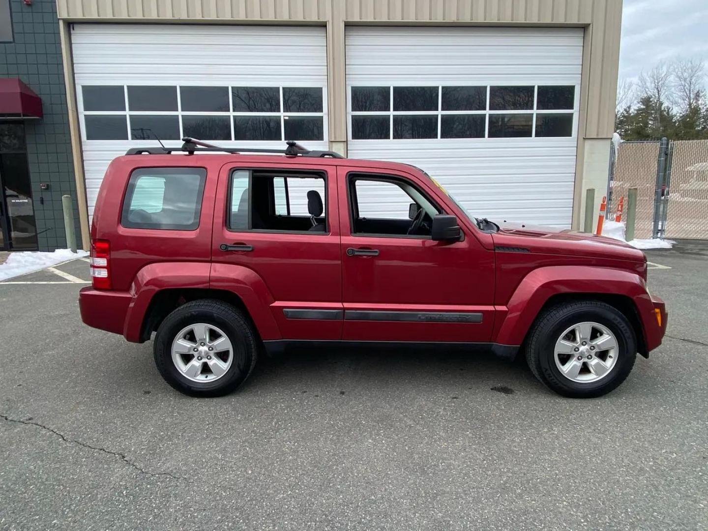 2012 Maroon /Grey Jeep Liberty Sport 4WD (1C4PJMAK9CW) with an 3.7L V6 SOHC 12V engine, 4-Speed Automatic transmission, located at 215 Milton St, Dedham, MA, 02026, (781) 329-5144, 42.241905, -71.157295 - Hop into this vibrant Burgundy 2012 Jeep Liberty and take on the roads with confidence! With its 4WD/AWD capabilities and traction control system, this adventure-ready SUV is perfect for exploring both city streets and off-road trails. Keeping your safety in mind, this Jeep is equipped with multiple - Photo#1