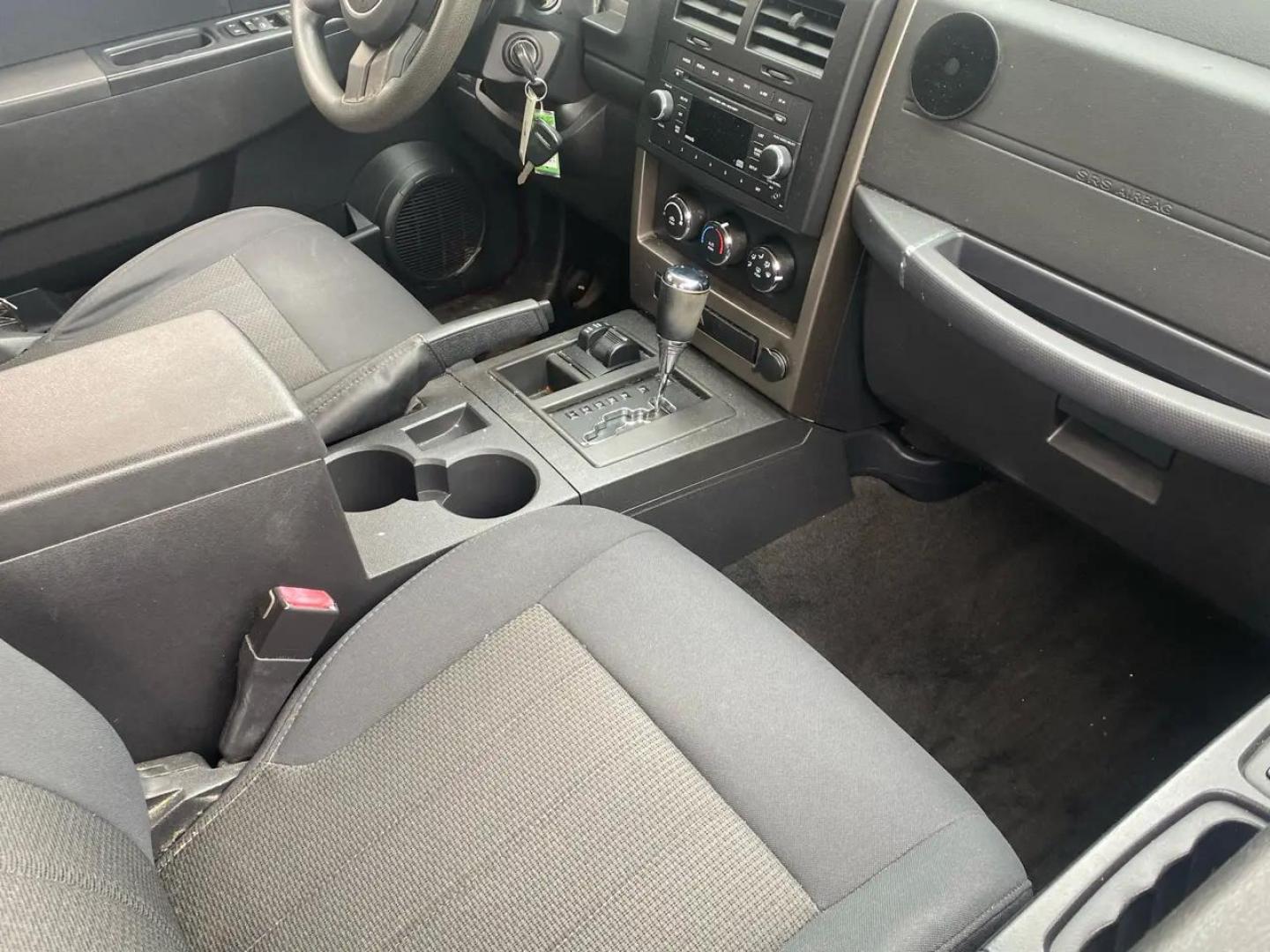 2012 Maroon /Grey Jeep Liberty Sport 4WD (1C4PJMAK9CW) with an 3.7L V6 SOHC 12V engine, 4-Speed Automatic transmission, located at 215 Milton St, Dedham, MA, 02026, (781) 329-5144, 42.241905, -71.157295 - Hop into this vibrant Burgundy 2012 Jeep Liberty and take on the roads with confidence! With its 4WD/AWD capabilities and traction control system, this adventure-ready SUV is perfect for exploring both city streets and off-road trails. Keeping your safety in mind, this Jeep is equipped with multiple - Photo#11