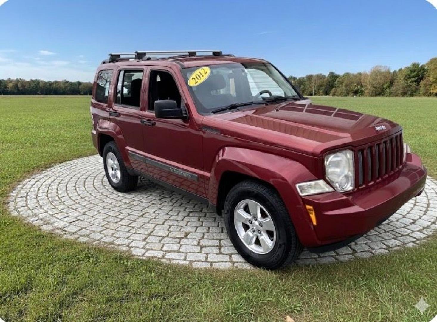 2012 Maroon /Grey Jeep Liberty Sport 4WD (1C4PJMAK9CW) with an 3.7L V6 SOHC 12V engine, 4-Speed Automatic transmission, located at 215 Milton St, Dedham, MA, 02026, (781) 329-5144, 42.241905, -71.157295 - Hop into this vibrant Burgundy 2012 Jeep Liberty and take on the roads with confidence! With its 4WD/AWD capabilities and traction control system, this adventure-ready SUV is perfect for exploring both city streets and off-road trails. Keeping your safety in mind, this Jeep is equipped with multiple - Photo#0