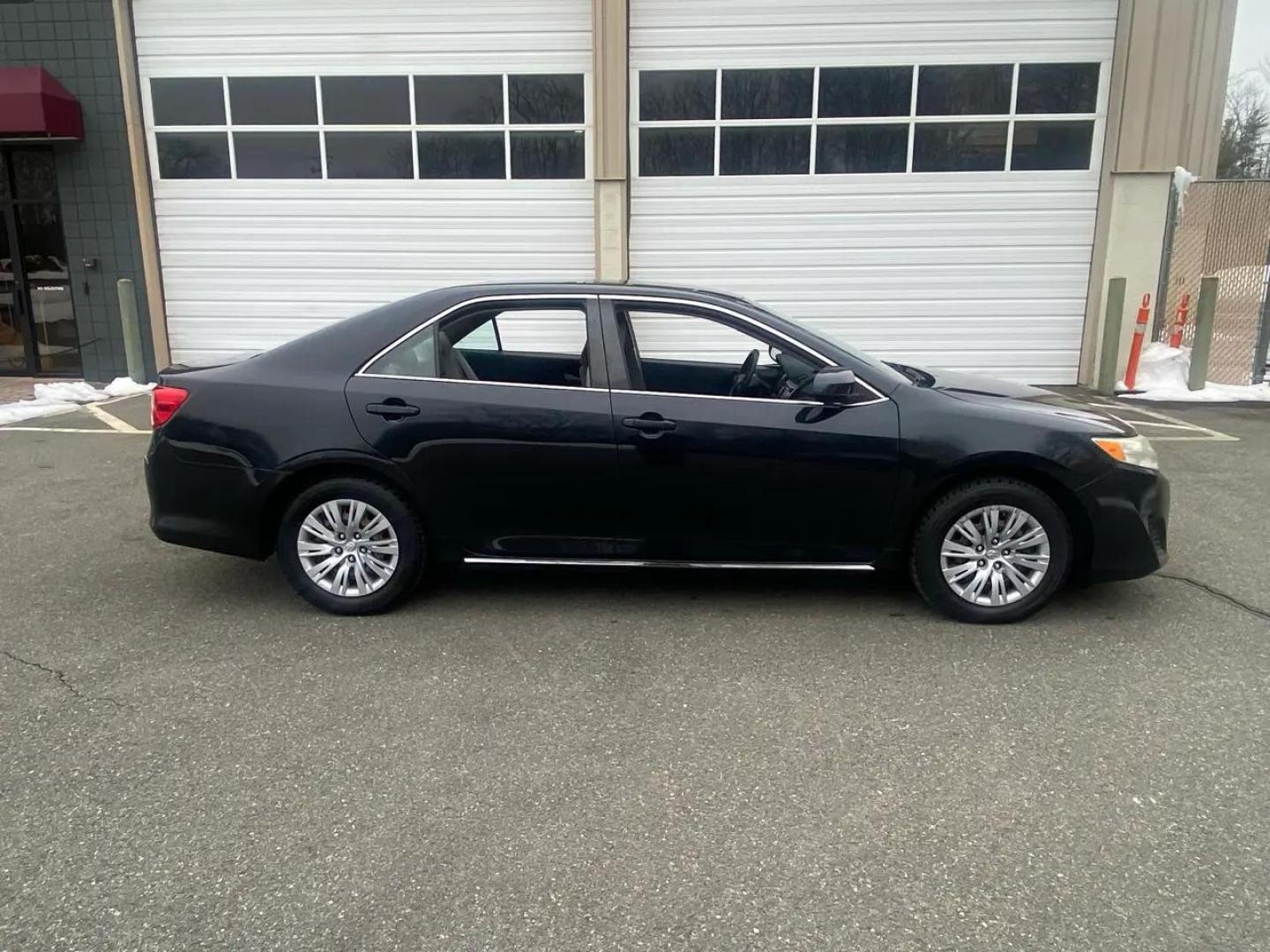 2012 BLACK /Grey Toyota Camry LE (4T1BF1FK8CU) with an 2.5L L4 DOHC 16V engine, 6-Speed Automatic transmission, located at 215 Milton St, Dedham, MA, 02026, (781) 329-5144, 42.241905, -71.157295 - Introducing the sleek and reliable 2012 Toyota Camry, a car that promises to take your driving experience to the next level. This sophisticated black beauty is not just a vehicle, but a true companion on the road. With a Carfax report available, you can rest assured that this Camry has a clean histo - Photo#3