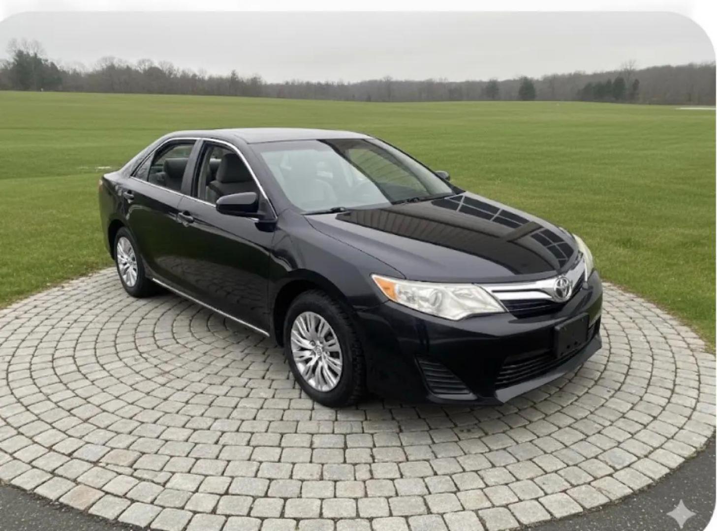 2012 BLACK /Grey Toyota Camry LE (4T1BF1FK8CU) with an 2.5L L4 DOHC 16V engine, 6-Speed Automatic transmission, located at 215 Milton St, Dedham, MA, 02026, (781) 329-5144, 42.241905, -71.157295 - Introducing the sleek and reliable 2012 Toyota Camry, a car that promises to take your driving experience to the next level. This sophisticated black beauty is not just a vehicle, but a true companion on the road. With a Carfax report available, you can rest assured that this Camry has a clean histo - Photo#0