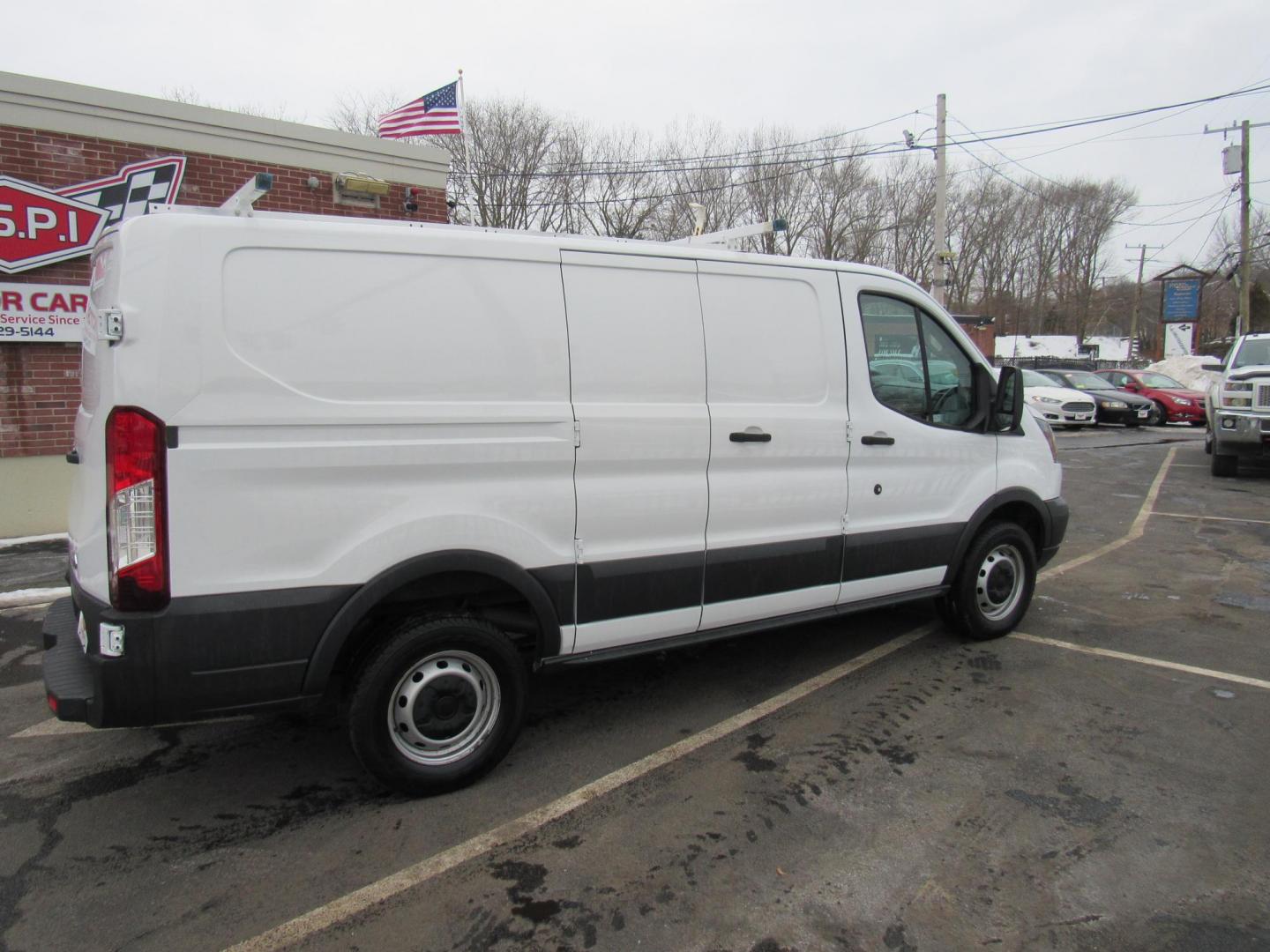 2016 White /Gray Ford Transit 250 Van Low Roof 60/40 Pass.130-in. WB (1FTYR1ZM5GK) with an 3.7L V6 DOHC 24V engine, 6A transmission, located at 215 Milton St, Dedham, MA, 02026, (781) 329-5144, 42.241905, -71.157295 - This nice low mileage cargo van is in excellent condition. Runs like new. All ASPI Motor Cras Vehicles are fully serviced before they are delivered to assure the highest quality used vehicles. Commercial service contracts are available. Call for details. Prices on all vehicles do not include $29 - Photo#7