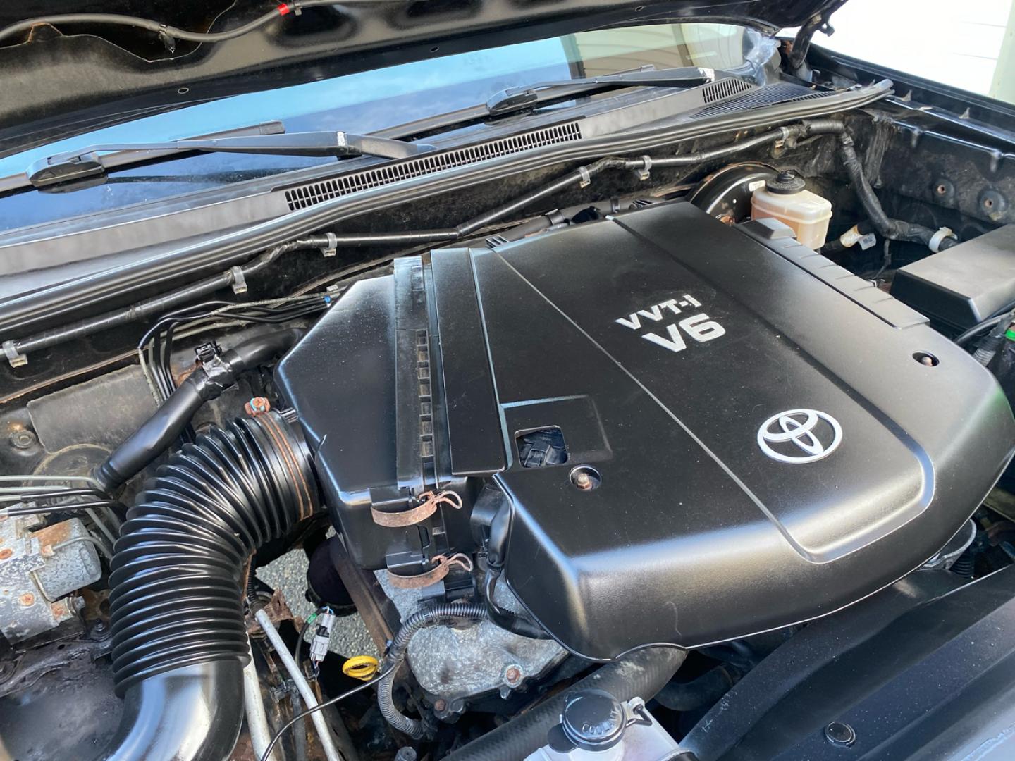 2007 BLACK /Tan Toyota TACOMA SR-5 (1FTMF1EM5DF) with an 3.5L V6 SOHC 24V engine, Automatic transmission, located at 215 Milton St, Dedham, MA, 02026, (781) 329-5144, 42.241905, -71.157295 - Introducing this sleek Black 2007 Toyota Tacoma! This rugged beauty is the perfect blend of style, versatility, and reliability. With its powerful engine and 4WD/AWD capabilities, this truck is ready to conquer any road ahead. The deep tinted glass adds a touch of mystery while keeping you cool on t - Photo#22