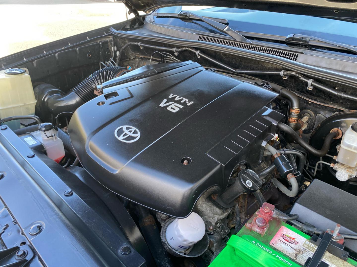 2007 BLACK /Tan Toyota TACOMA SR-5 (1FTMF1EM5DF) with an 3.5L V6 SOHC 24V engine, Automatic transmission, located at 215 Milton St, Dedham, MA, 02026, (781) 329-5144, 42.241905, -71.157295 - Introducing this sleek Black 2007 Toyota Tacoma! This rugged beauty is the perfect blend of style, versatility, and reliability. With its powerful engine and 4WD/AWD capabilities, this truck is ready to conquer any road ahead. The deep tinted glass adds a touch of mystery while keeping you cool on t - Photo#23