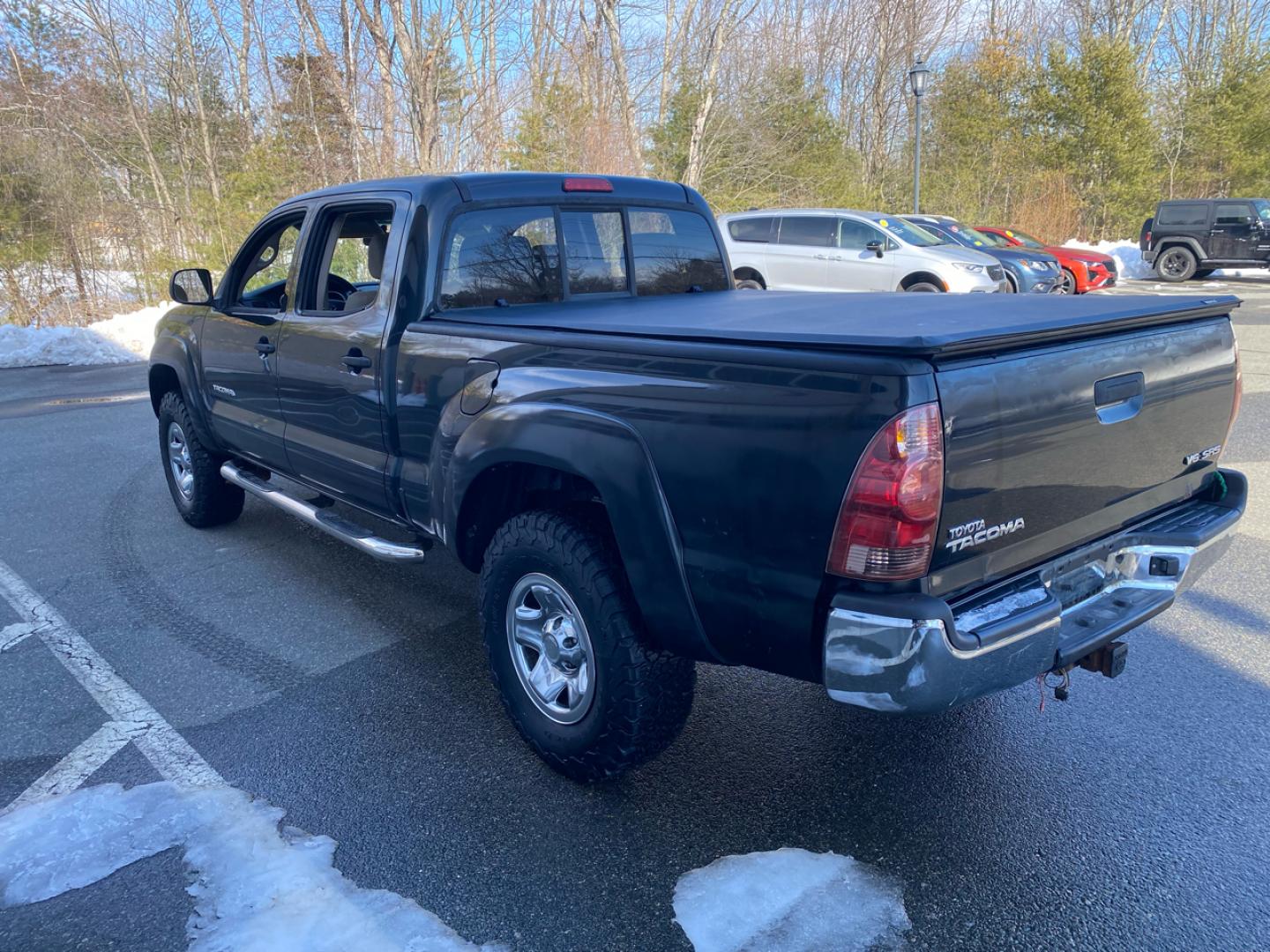 2007 BLACK /Tan Toyota Tacoma Double Cab Long Bed V6 Auto 4WD (5TEMU52N57Z) with an 4.0L V6 DOHC 24V engine, 5-Speed Automatic Overdrive transmission, located at 215 Milton St, Dedham, MA, 02026, (781) 329-5144, 42.241905, -71.157295 - Introducing this sleek Black 2007 Toyota Tacoma! This rugged beauty is the perfect blend of style, versatility, and reliability. With its powerful engine and 4WD/AWD capabilities, this truck is ready to conquer any road ahead. The deep tinted glass adds a touch of mystery while keeping you cool on t - Photo#5