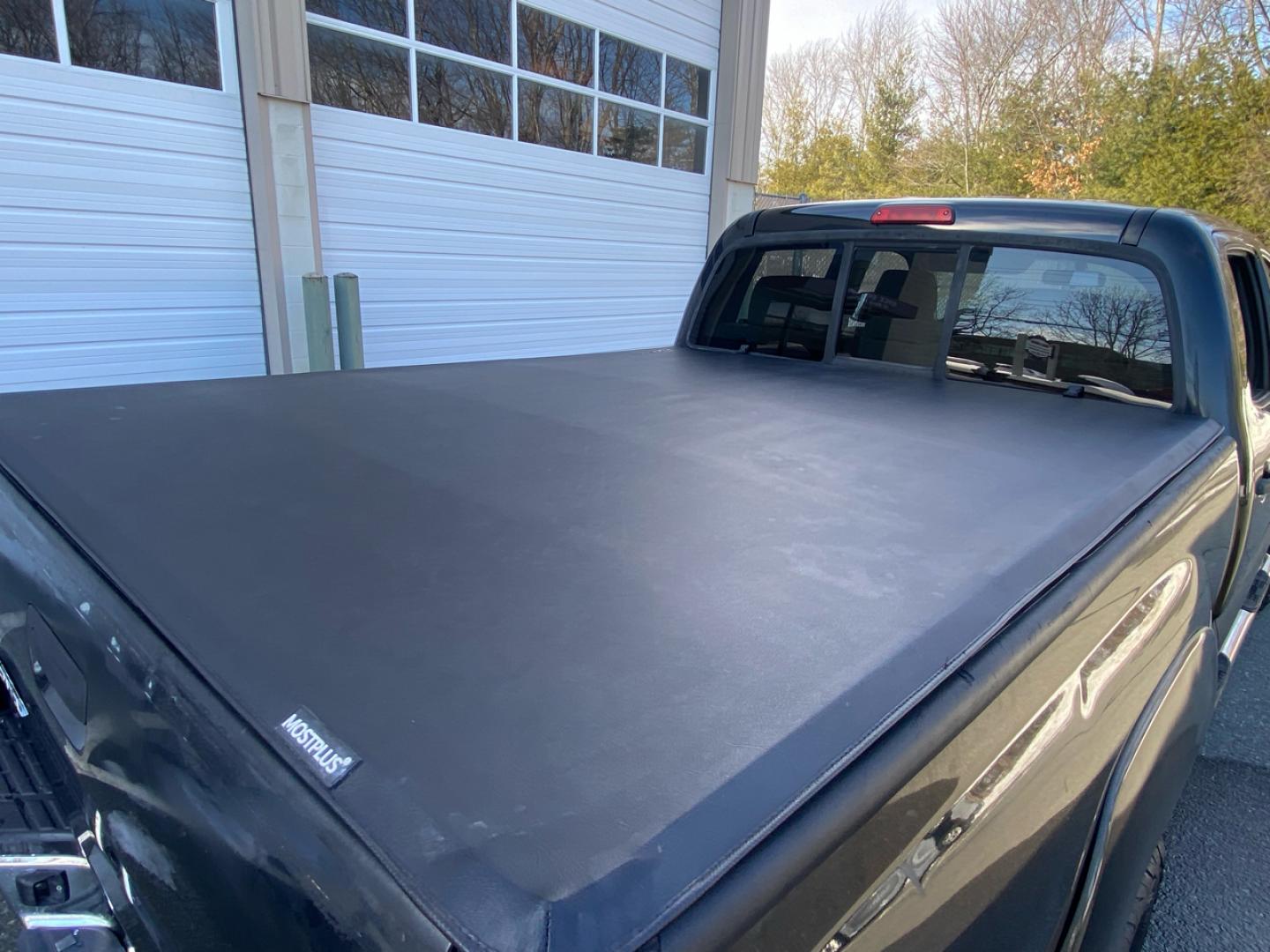 2007 BLACK /Tan Toyota Tacoma Double Cab Long Bed V6 Auto 4WD (5TEMU52N57Z) with an 4.0L V6 DOHC 24V engine, 5-Speed Automatic Overdrive transmission, located at 215 Milton St, Dedham, MA, 02026, (781) 329-5144, 42.241905, -71.157295 - Introducing this sleek Black 2007 Toyota Tacoma! This rugged beauty is the perfect blend of style, versatility, and reliability. With its powerful engine and 4WD/AWD capabilities, this truck is ready to conquer any road ahead. The deep tinted glass adds a touch of mystery while keeping you cool on t - Photo#17