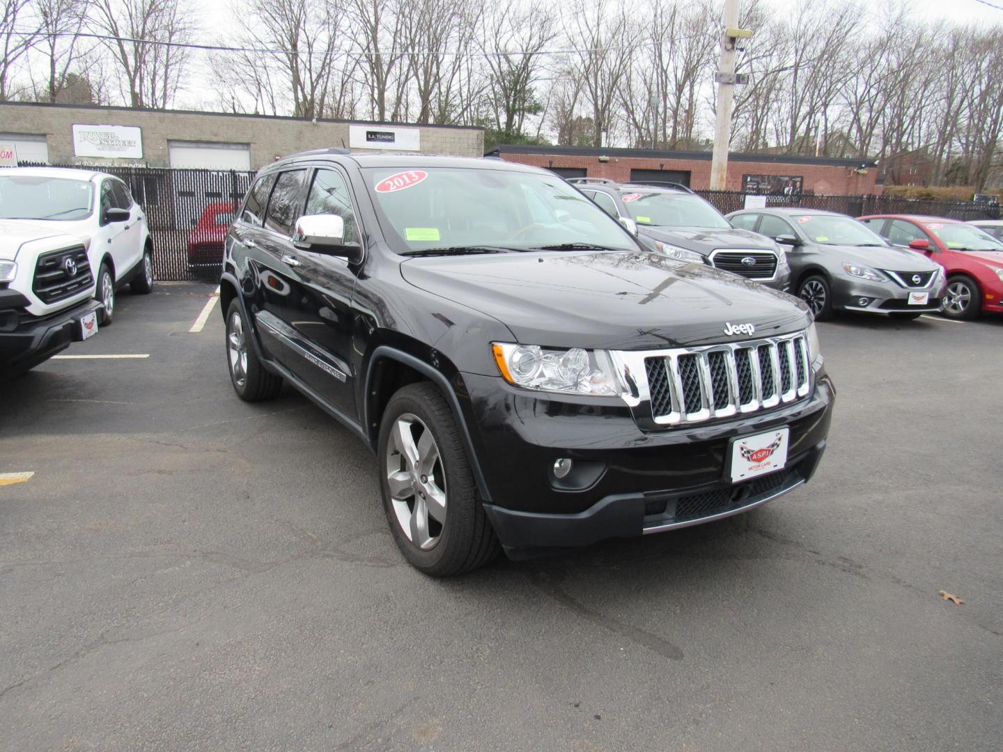2013 BLACK /Tan Jeep Grand Cherokee Overland 4WD (1C4RJFCT6DC) with an 5.7L V8 OHV 16V engine, 5-Speed Automatic transmission, located at 215 Milton St, Dedham, MA, 02026, (781) 329-5144, 42.241905, -71.157295 - There is not many options this low mile Grand Cherokee does not have. Summit edition, panoramic roof, Leather, Loaded up. In excellent condition for the year, you won't believe it is a 2013. All ASPI Motor Cars vehicles are fully serviced before they are delivered to assure the highest quality used - Photo#0