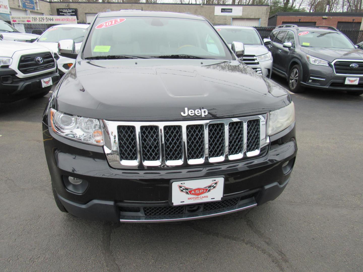 2013 BLACK /Tan Jeep Grand Cherokee Overland 4WD (1C4RJFCT6DC) with an 5.7L V8 OHV 16V engine, 5-Speed Automatic transmission, located at 215 Milton St, Dedham, MA, 02026, (781) 329-5144, 42.241905, -71.157295 - There is not many options this low mile Grand Cherokee does not have. Summit edition, panoramic roof, Leather, Loaded up. In excellent condition for the year, you won't believe it is a 2013. All ASPI Motor Cars vehicles are fully serviced before they are delivered to assure the highest quality used - Photo#1