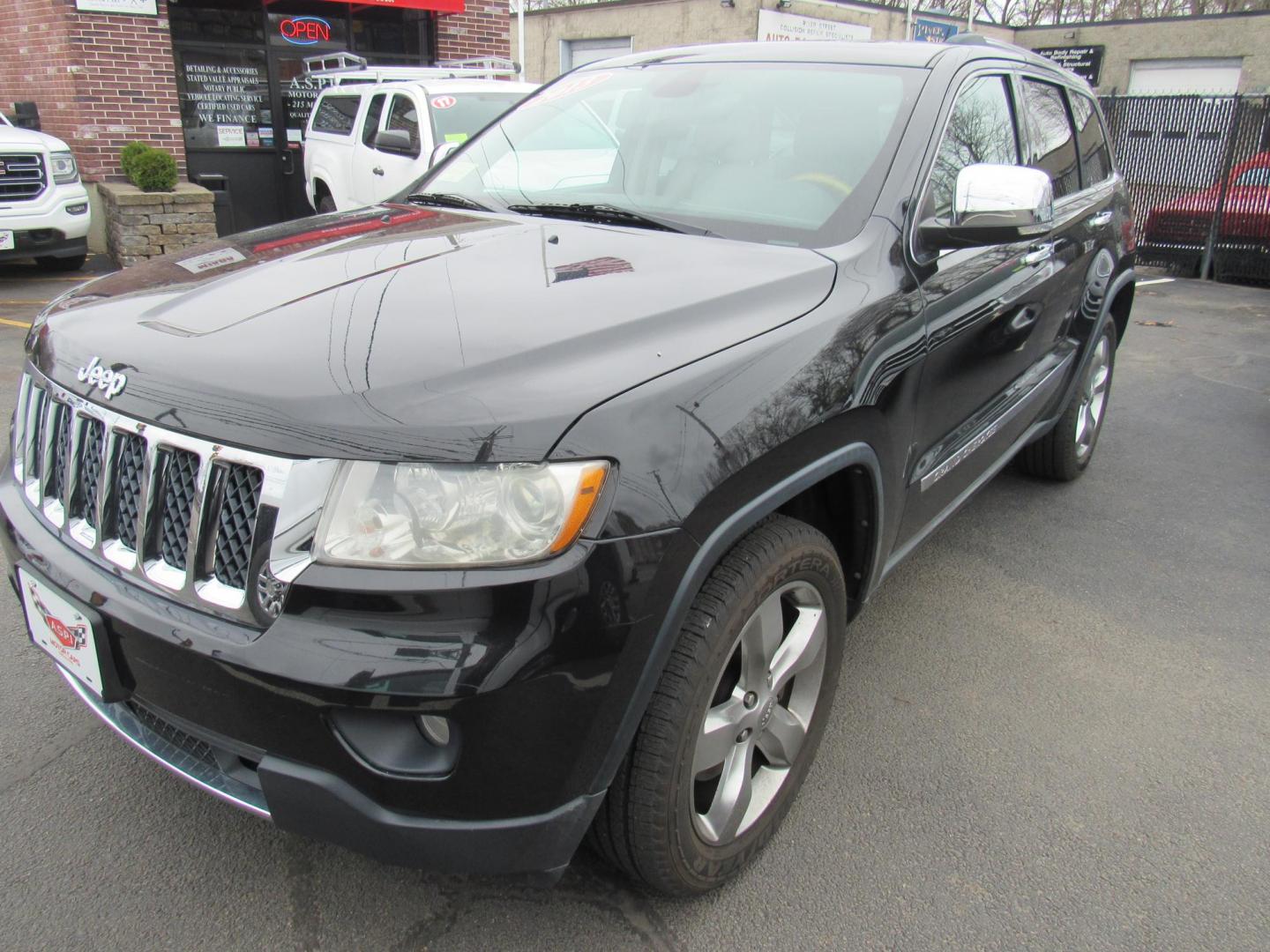 2013 BLACK /Tan Jeep Grand Cherokee Overland 4WD (1C4RJFCT6DC) with an 5.7L V8 OHV 16V engine, 5-Speed Automatic transmission, located at 215 Milton St, Dedham, MA, 02026, (781) 329-5144, 42.241905, -71.157295 - There is not many options this low mile Grand Cherokee does not have. Summit edition, panoramic roof, Leather, Loaded up. In excellent condition for the year, you won't believe it is a 2013. All ASPI Motor Cars vehicles are fully serviced before they are delivered to assure the highest quality used - Photo#2