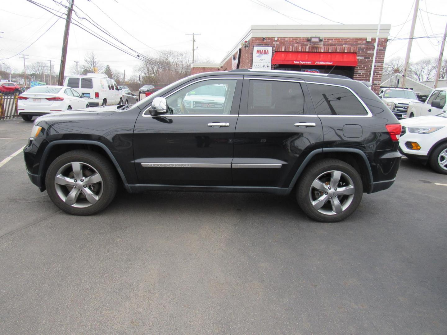 2013 BLACK /Tan Jeep Grand Cherokee Overland 4WD (1C4RJFCT6DC) with an 5.7L V8 OHV 16V engine, 5-Speed Automatic transmission, located at 215 Milton St, Dedham, MA, 02026, (781) 329-5144, 42.241905, -71.157295 - There is not many options this low mile Grand Cherokee does not have. Summit edition, panoramic roof, Leather, Loaded up. In excellent condition for the year, you won't believe it is a 2013. All ASPI Motor Cars vehicles are fully serviced before they are delivered to assure the highest quality used - Photo#3