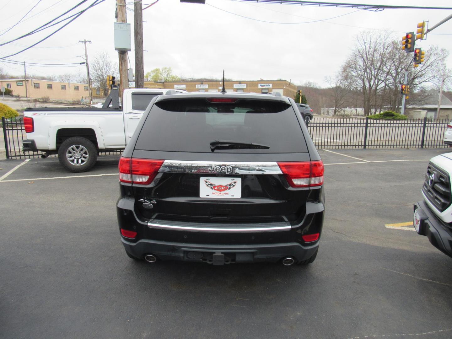2013 BLACK /Tan Jeep Grand Cherokee Overland 4WD (1C4RJFCT6DC) with an 5.7L V8 OHV 16V engine, 5-Speed Automatic transmission, located at 215 Milton St, Dedham, MA, 02026, (781) 329-5144, 42.241905, -71.157295 - There is not many options this low mile Grand Cherokee does not have. Summit edition, panoramic roof, Leather, Loaded up. In excellent condition for the year, you won't believe it is a 2013. All ASPI Motor Cars vehicles are fully serviced before they are delivered to assure the highest quality used - Photo#5