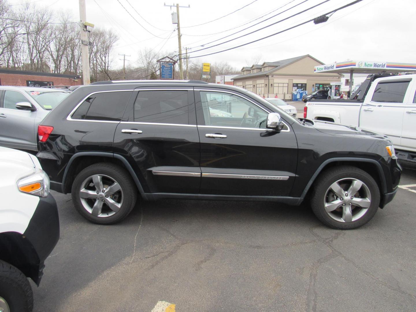 2013 BLACK /Tan Jeep Grand Cherokee Overland 4WD (1C4RJFCT6DC) with an 5.7L V8 OHV 16V engine, 5-Speed Automatic transmission, located at 215 Milton St, Dedham, MA, 02026, (781) 329-5144, 42.241905, -71.157295 - There is not many options this low mile Grand Cherokee does not have. Summit edition, panoramic roof, Leather, Loaded up. In excellent condition for the year, you won't believe it is a 2013. All ASPI Motor Cars vehicles are fully serviced before they are delivered to assure the highest quality used - Photo#7