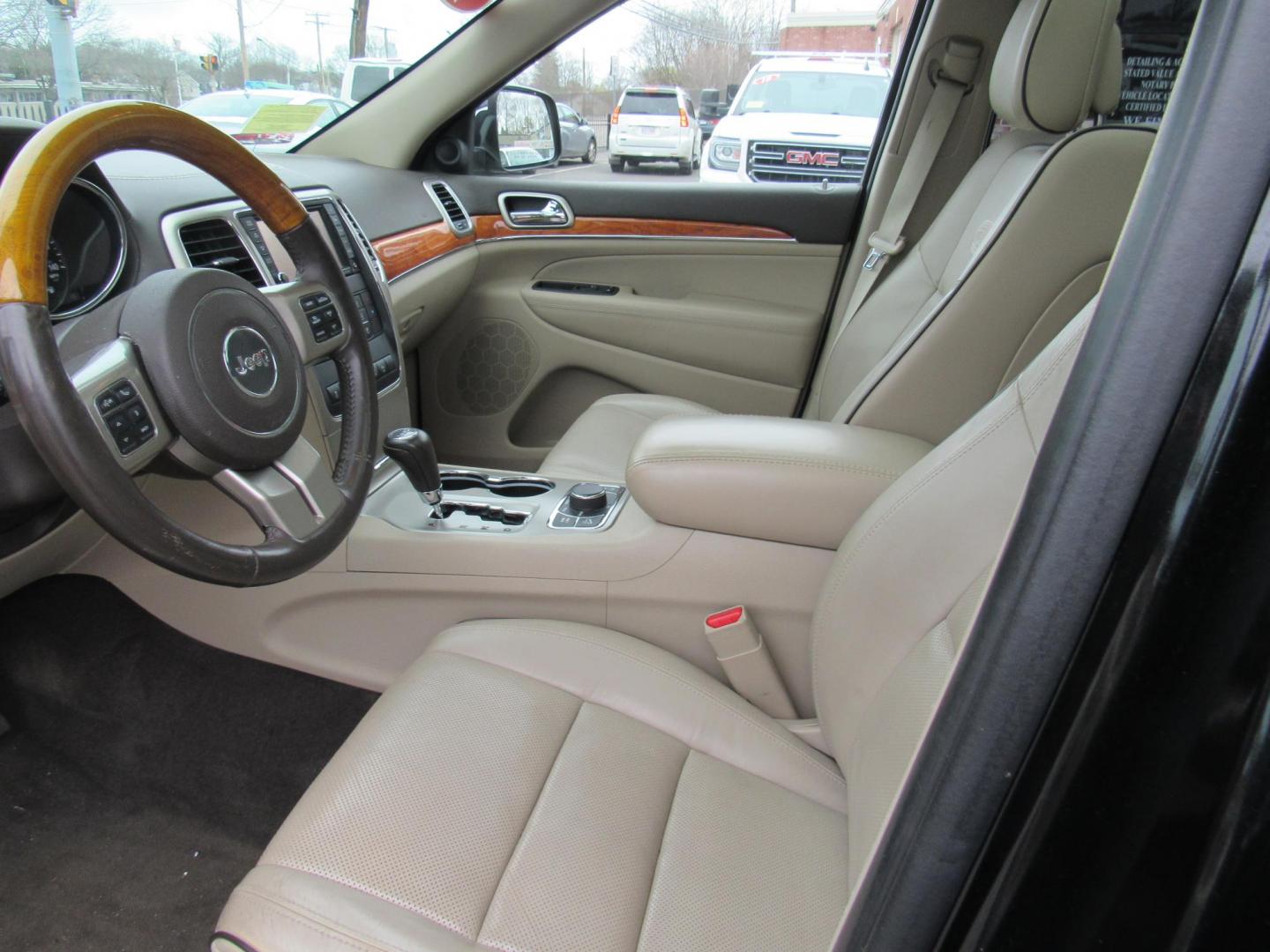 2013 BLACK /Tan Jeep Grand Cherokee Overland 4WD (1C4RJFCT6DC) with an 5.7L V8 OHV 16V engine, 5-Speed Automatic transmission, located at 215 Milton St, Dedham, MA, 02026, (781) 329-5144, 42.241905, -71.157295 - There is not many options this low mile Grand Cherokee does not have. Summit edition, panoramic roof, Leather, Loaded up. In excellent condition for the year, you won't believe it is a 2013. All ASPI Motor Cars vehicles are fully serviced before they are delivered to assure the highest quality used - Photo#12