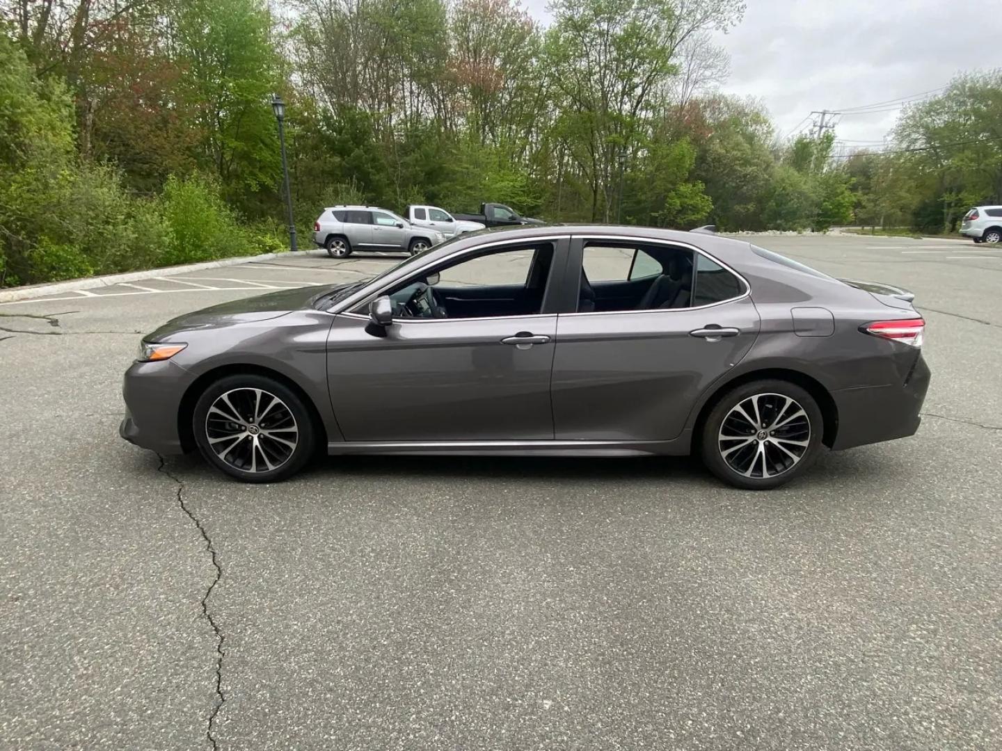 2020 bronze /Grey Toyota Camry SE (4T1G11AK3LU) with an 2.5L L4 DOHC 16V engine, 8A transmission, located at 215 Milton St, Dedham, MA, 02026, (781) 329-5144, 42.241905, -71.157295 - Get ready to cruise in style with this sleek Bronze 2020 Toyota Camry! This beauty not only offers a smooth ride but also prioritizes safety with features like Child Safety Door Locks and multiple airbags. Worried about theft? No need to fret, as this car comes equipped with Vehicle Anti-Theft techn - Photo#5
