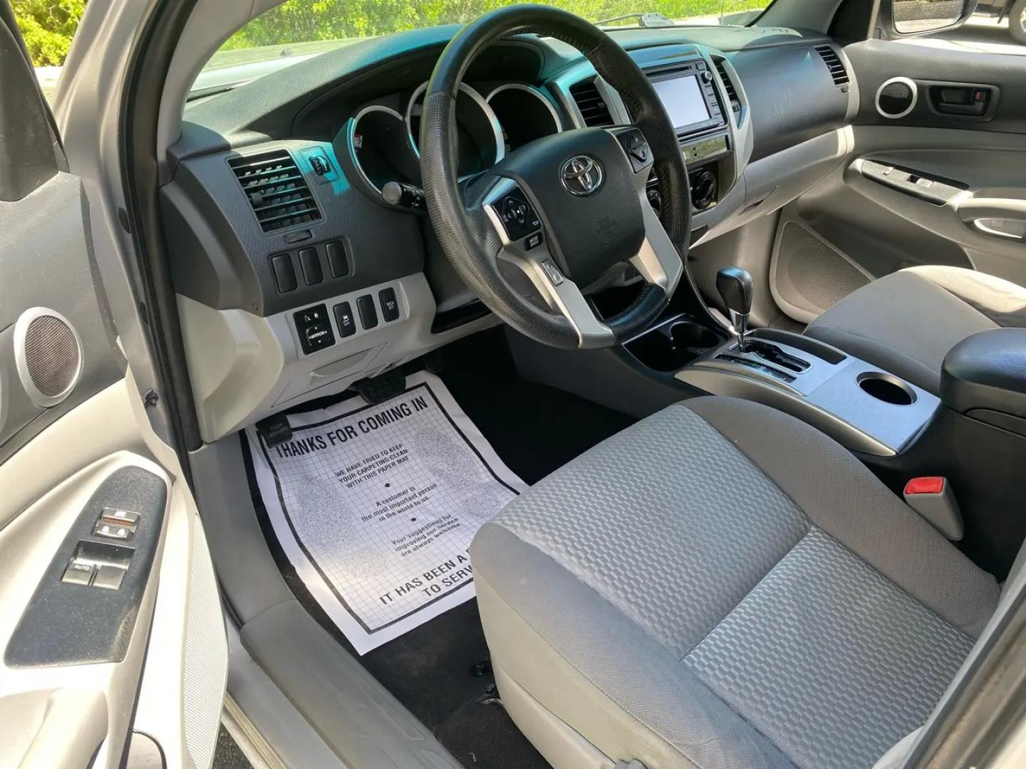 2014 Silver /Grey Toyota Tacoma Access Cab I4 5MT 4WD (5TFUX4EN1EX) with an 2.7L L4 DOHC 16V engine, Automatic transmission, located at 215 Milton St, Dedham, MA, 02026, (781) 329-5144, 42.241905, -71.157295 - Meet the silver 2014 Toyota Tacoma—a hardworking used truck that’s ready for weekday duty and weekend dirt. With a 2.7L 4-cylinder gasoline engine and an automatic transmission, it keeps things simple, dependable, and easy to drive, while its 4WD drivetrain is there when the pavement ends and th - Photo#7