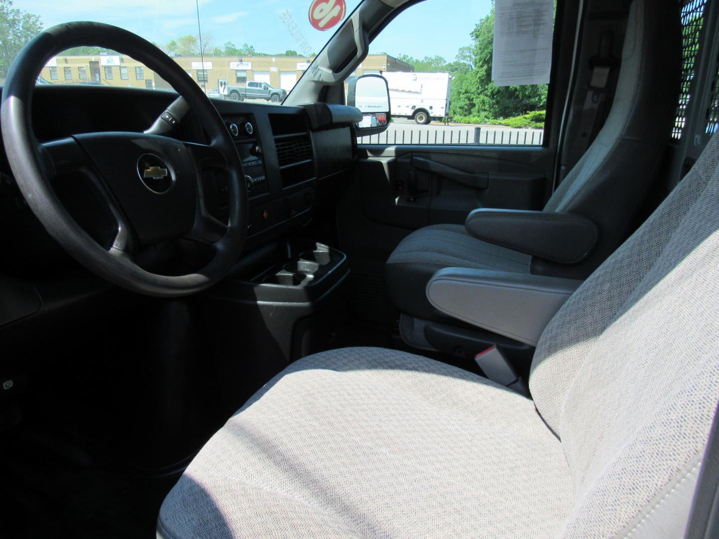 2016 White /Gray Chevrolet Express 2500 Cargo (1GCWGAFF8G1) with an 4.8L V8 FFV engine, 6A transmission, located at 215 Milton St, Dedham, MA, 02026, (781) 329-5144, 42.241905, -71.157295 - Where is the next one with 22 K miles on it. Great opportunity to save big on this nice work van. Racks and bins as well as ladder racks already installed. Fully serviced and ready to go. This was a local facility maintenance van that never left the campus except for service. Check it out today! - Photo#16
