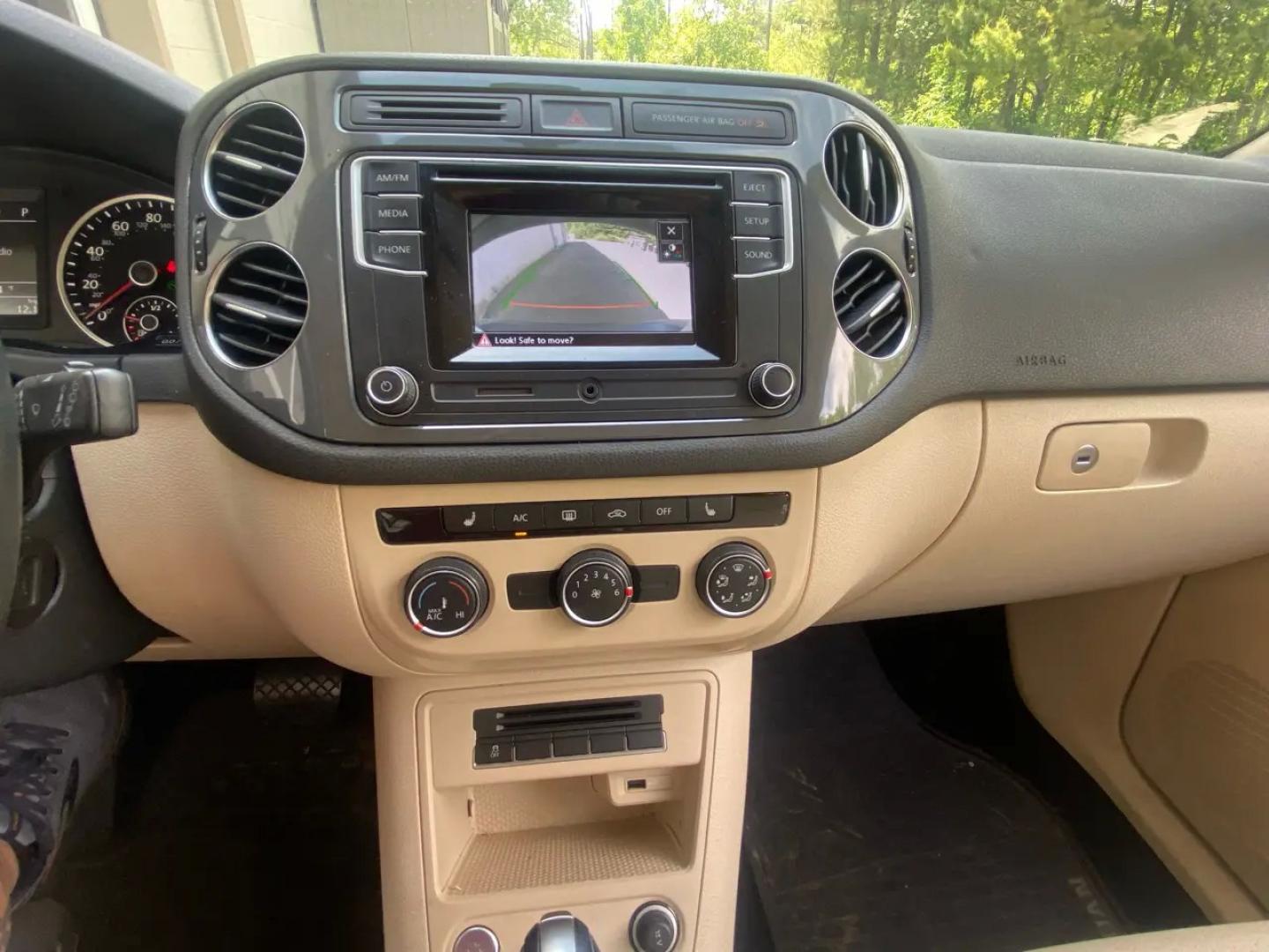 2016 White /Tan Volkswagen Tiguan SE 4Motion (WVGBV7AX5GW) with an 2.0L L4 DOHC 16V TURBO engine, 6A transmission, located at 215 Milton St, Dedham, MA, 02026, (781) 329-5144, 42.241905, -71.157295 - Hop into this sporty 2016 Volkswagen Tiguan and get ready for an adventure! With sleek white exterior and stylish alloy wheels, this car is sure to turn heads as you cruise down the road. You can rest easy knowing that safety is a top priority with features like ABS brakes, traction control, and mul- Photo#12
