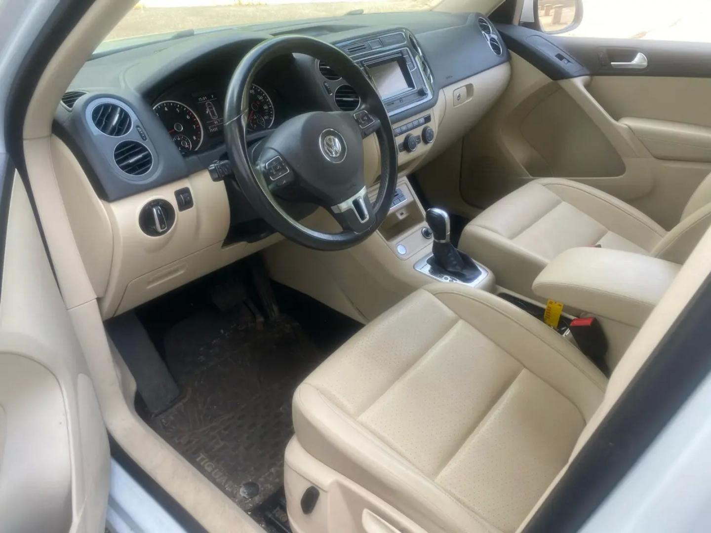 2016 White /Tan Volkswagen Tiguan SE 4Motion (WVGBV7AX5GW) with an 2.0L L4 DOHC 16V TURBO engine, 6A transmission, located at 215 Milton St, Dedham, MA, 02026, (781) 329-5144, 42.241905, -71.157295 - Hop into this sporty 2016 Volkswagen Tiguan and get ready for an adventure! With sleek white exterior and stylish alloy wheels, this car is sure to turn heads as you cruise down the road. You can rest easy knowing that safety is a top priority with features like ABS brakes, traction control, and mul- Photo#9