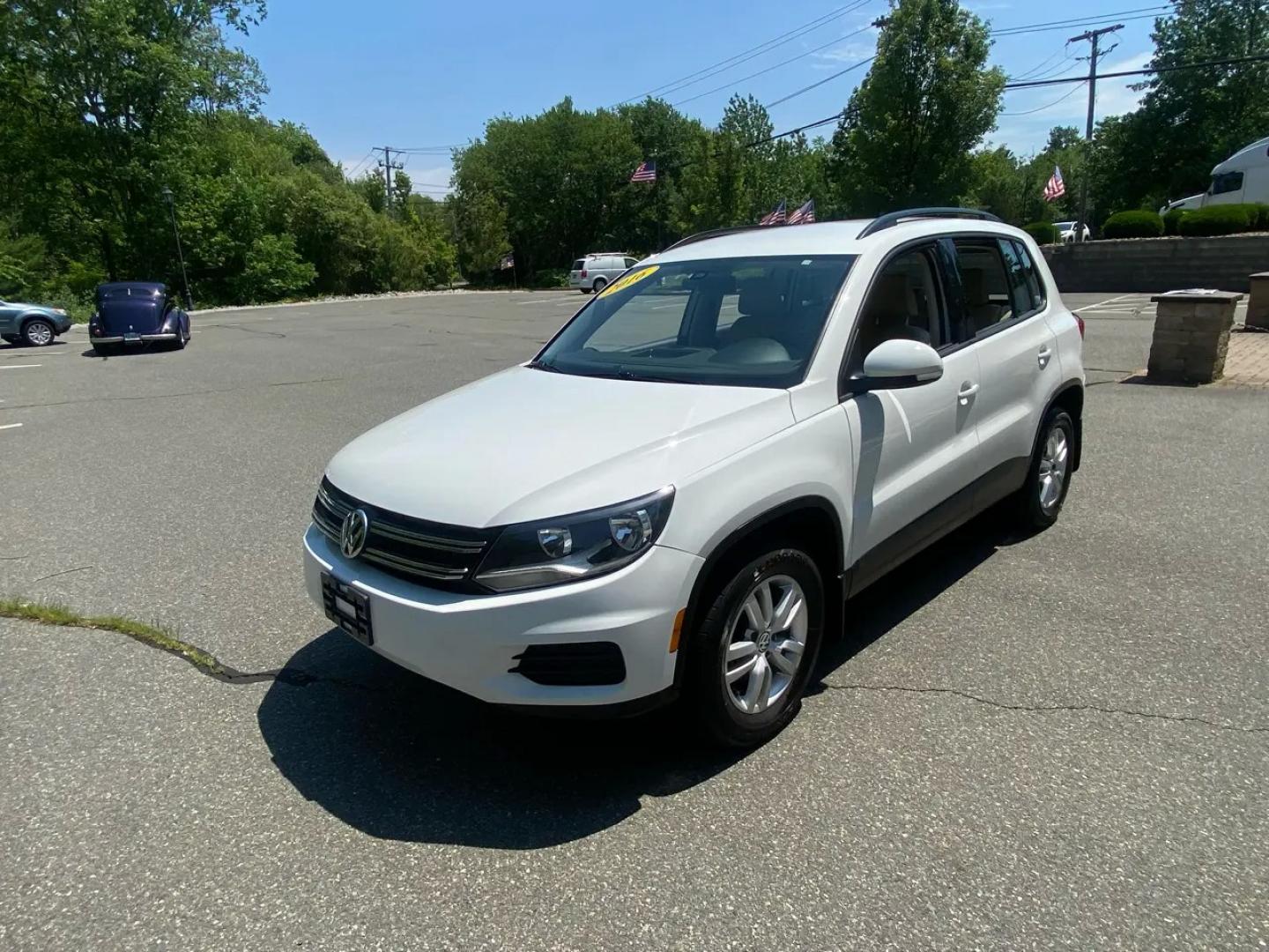2016 White /Tan Volkswagen Tiguan SE 4Motion (WVGBV7AX5GW) with an 2.0L L4 DOHC 16V TURBO engine, 6A transmission, located at 215 Milton St, Dedham, MA, 02026, (781) 329-5144, 42.241905, -71.157295 - Hop into this sporty 2016 Volkswagen Tiguan and get ready for an adventure! With sleek white exterior and stylish alloy wheels, this car is sure to turn heads as you cruise down the road. You can rest easy knowing that safety is a top priority with features like ABS brakes, traction control, and mul- Photo#3