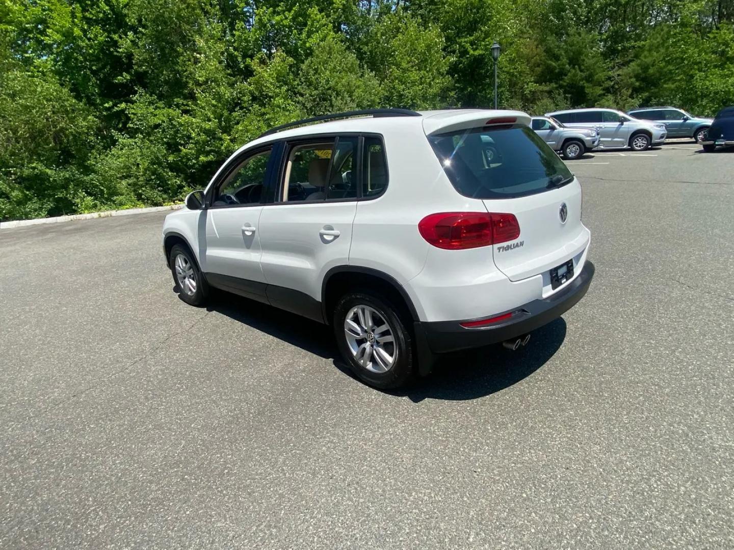 2016 White /Tan Volkswagen Tiguan SE 4Motion (WVGBV7AX5GW) with an 2.0L L4 DOHC 16V TURBO engine, 6A transmission, located at 215 Milton St, Dedham, MA, 02026, (781) 329-5144, 42.241905, -71.157295 - Hop into this sporty 2016 Volkswagen Tiguan and get ready for an adventure! With sleek white exterior and stylish alloy wheels, this car is sure to turn heads as you cruise down the road. You can rest easy knowing that safety is a top priority with features like ABS brakes, traction control, and mul- Photo#5