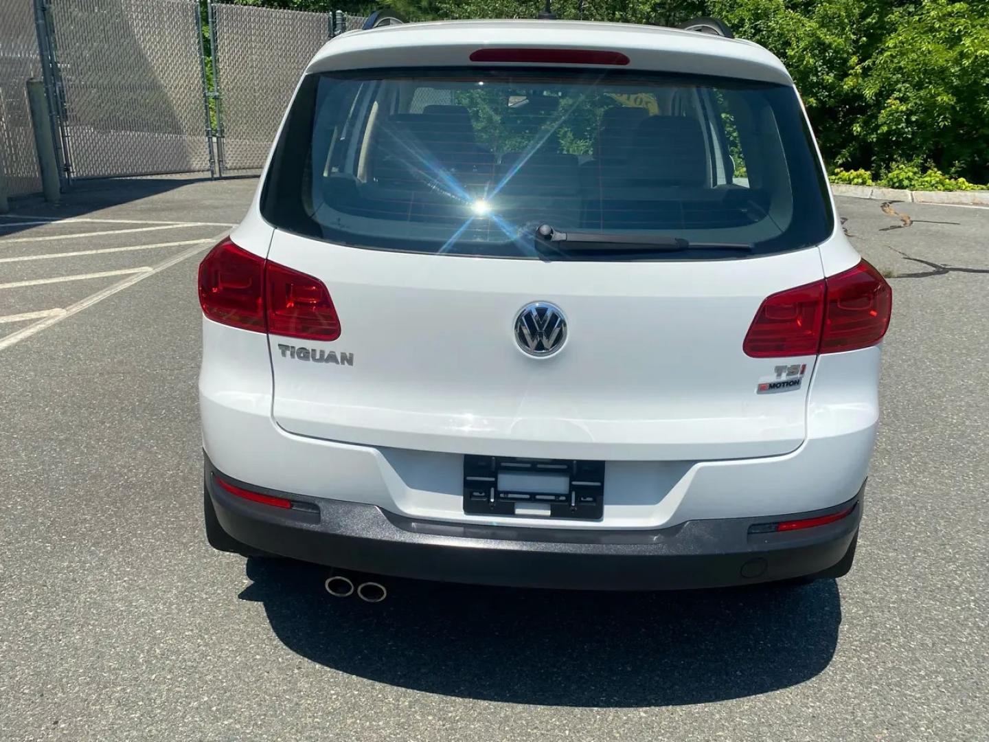 2016 White /Tan Volkswagen Tiguan SE 4Motion (WVGBV7AX5GW) with an 2.0L L4 DOHC 16V TURBO engine, 6A transmission, located at 215 Milton St, Dedham, MA, 02026, (781) 329-5144, 42.241905, -71.157295 - Hop into this sporty 2016 Volkswagen Tiguan and get ready for an adventure! With sleek white exterior and stylish alloy wheels, this car is sure to turn heads as you cruise down the road. You can rest easy knowing that safety is a top priority with features like ABS brakes, traction control, and mul- Photo#7