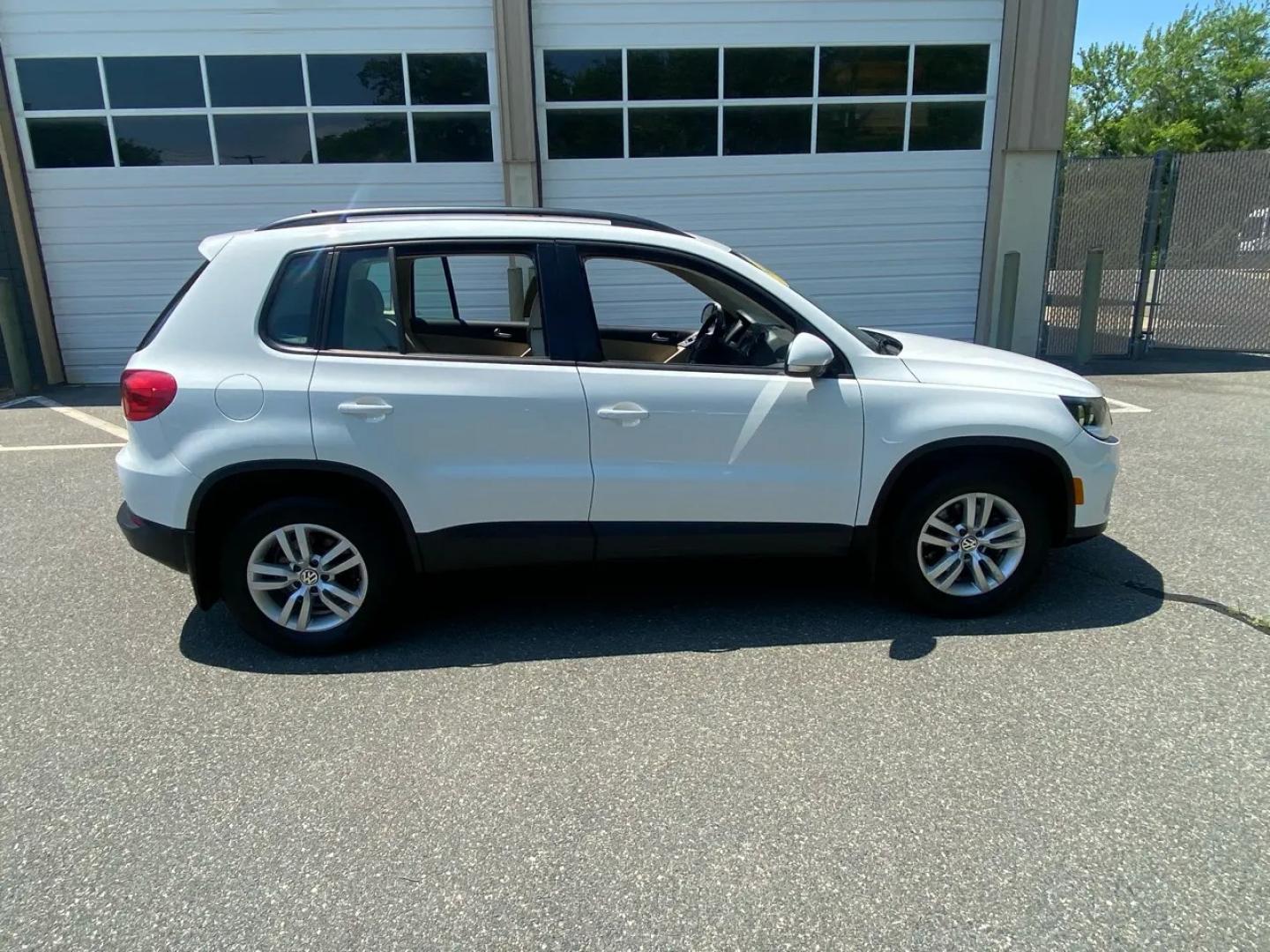 2016 White /Tan Volkswagen Tiguan SE 4Motion (WVGBV7AX5GW) with an 2.0L L4 DOHC 16V TURBO engine, 6A transmission, located at 215 Milton St, Dedham, MA, 02026, (781) 329-5144, 42.241905, -71.157295 - Hop into this sporty 2016 Volkswagen Tiguan and get ready for an adventure! With sleek white exterior and stylish alloy wheels, this car is sure to turn heads as you cruise down the road. You can rest easy knowing that safety is a top priority with features like ABS brakes, traction control, and mul- Photo#1