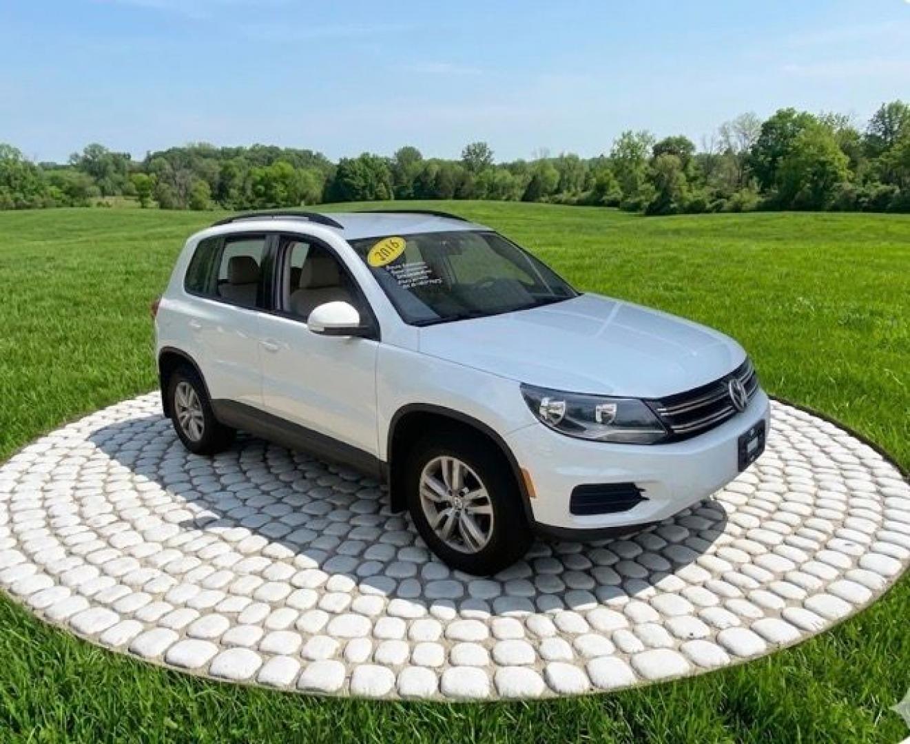 2016 White /Tan Volkswagen Tiguan SE 4Motion (WVGBV7AX5GW) with an 2.0L L4 DOHC 16V TURBO engine, 6A transmission, located at 215 Milton St, Dedham, MA, 02026, (781) 329-5144, 42.241905, -71.157295 - Hop into this sporty 2016 Volkswagen Tiguan and get ready for an adventure! With sleek white exterior and stylish alloy wheels, this car is sure to turn heads as you cruise down the road. You can rest easy knowing that safety is a top priority with features like ABS brakes, traction control, and mul- Photo#0