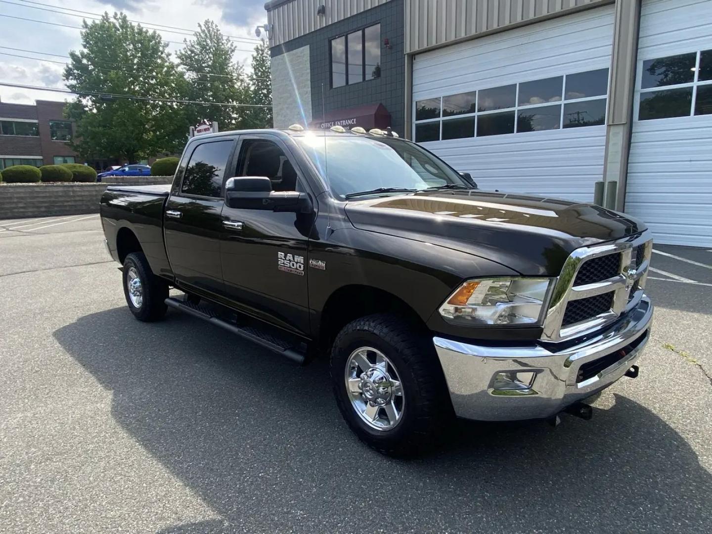 2013 Bronz /Grey RAM 2500 SLT Crew Cab SWB 4WD (3C6TR5DT8DG) with an 5.7L V8 OHV 16V engine, 6A transmission, located at 215 Milton St, Dedham, MA, 02026, (781) 329-5144, 42.241905, -71.157295 - This Bronze 2013 RAM 2500 is the kind of truck that looks ready for work even when it’s headed out for the weekend. Under the hood, the 5.7L gasoline V8 brings the muscle, while 4WD and a confident mix of traction control, ABS, and stability control help keep things planted when the road (or jobsi- Photo#1
