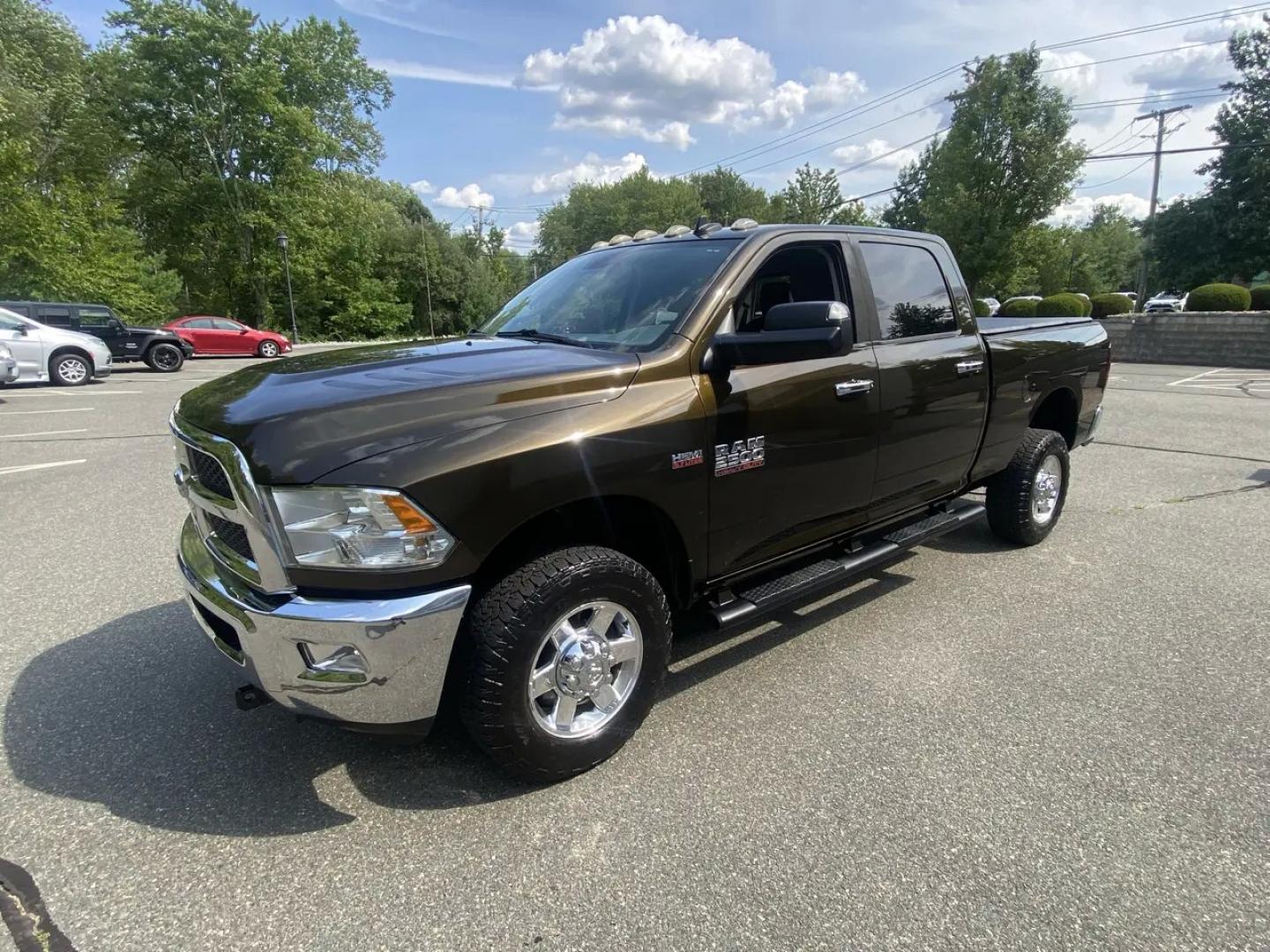 2013 Bronz /Grey RAM 2500 SLT Crew Cab SWB 4WD (3C6TR5DT8DG) with an 5.7L V8 OHV 16V engine, 6A transmission, located at 215 Milton St, Dedham, MA, 02026, (781) 329-5144, 42.241905, -71.157295 - This Bronze 2013 RAM 2500 is the kind of truck that looks ready for work even when it’s headed out for the weekend. Under the hood, the 5.7L gasoline V8 brings the muscle, while 4WD and a confident mix of traction control, ABS, and stability control help keep things planted when the road (or jobsi- Photo#4